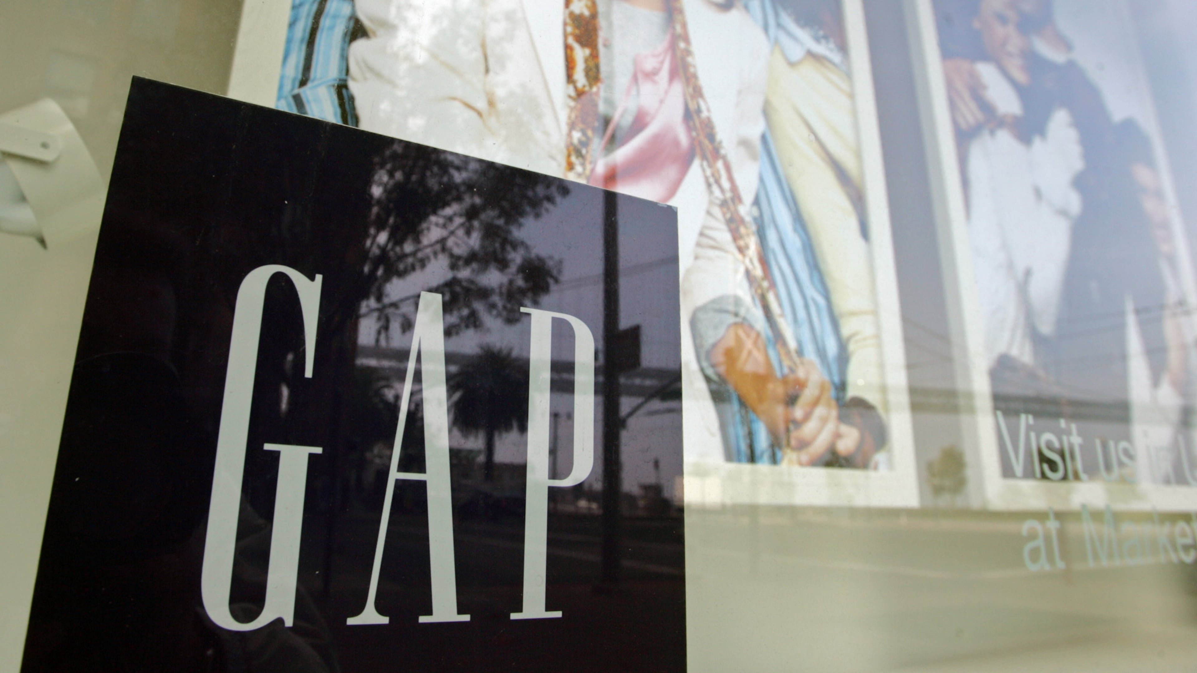 A window display shows current clothing styles at the headquarters of the Gap in San Francisco, Thursday, Nov. 18, 2004. (AP Photo/Eric Risberg,File)