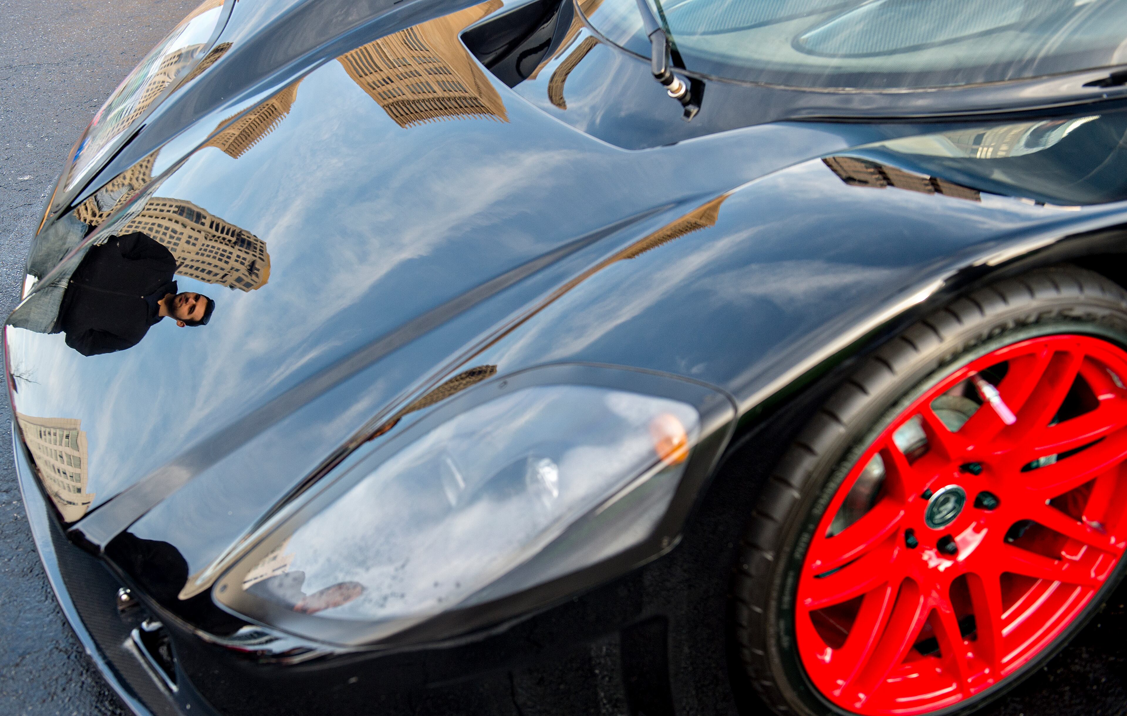 Antonio Alfieri (left) is reflected in the hood of one of the numerous Italian sports cars that were present. JONATHAN PHILLIPS / SPECIAL