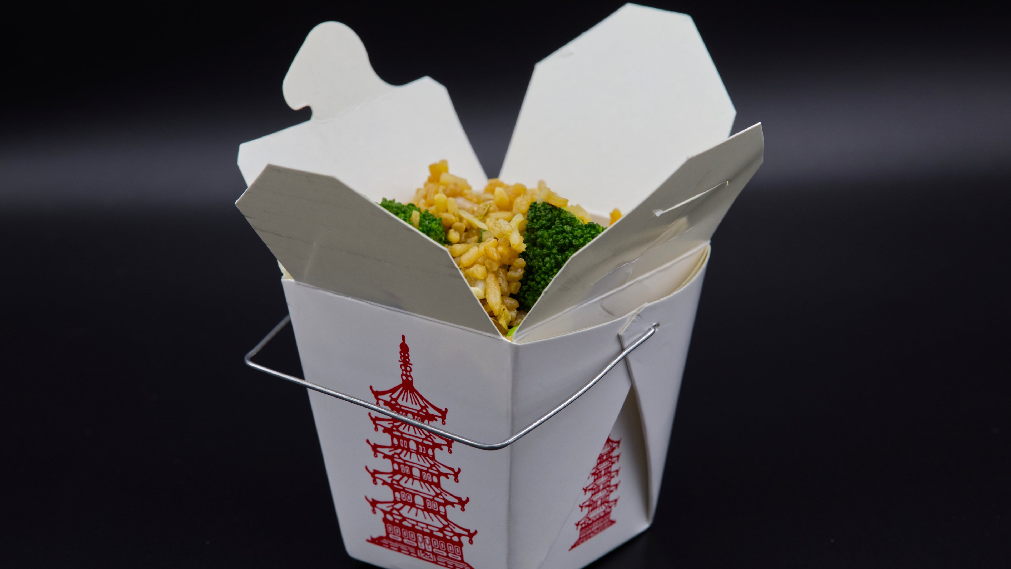 A Chinese takeout container with fried rice inside is photographed in Phoenix, May 12, 2026. (AP Photo/Dario Lopez-Mills)