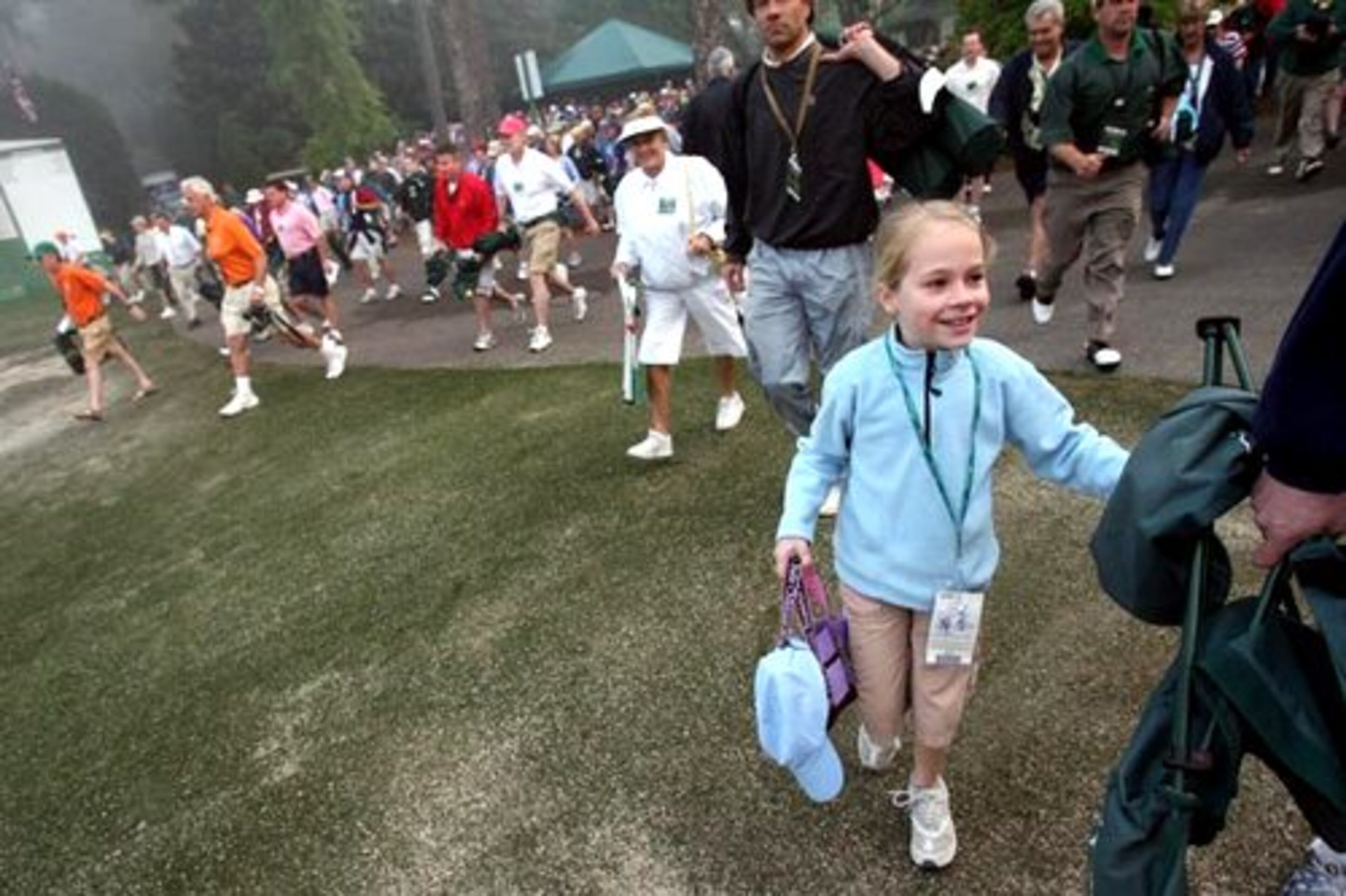 And when the gates open, a happy Katie Thome hangs on to her dad Mike. He said, "It's wonderful. They hear us talking about it (The Masters) and now they can experience it."