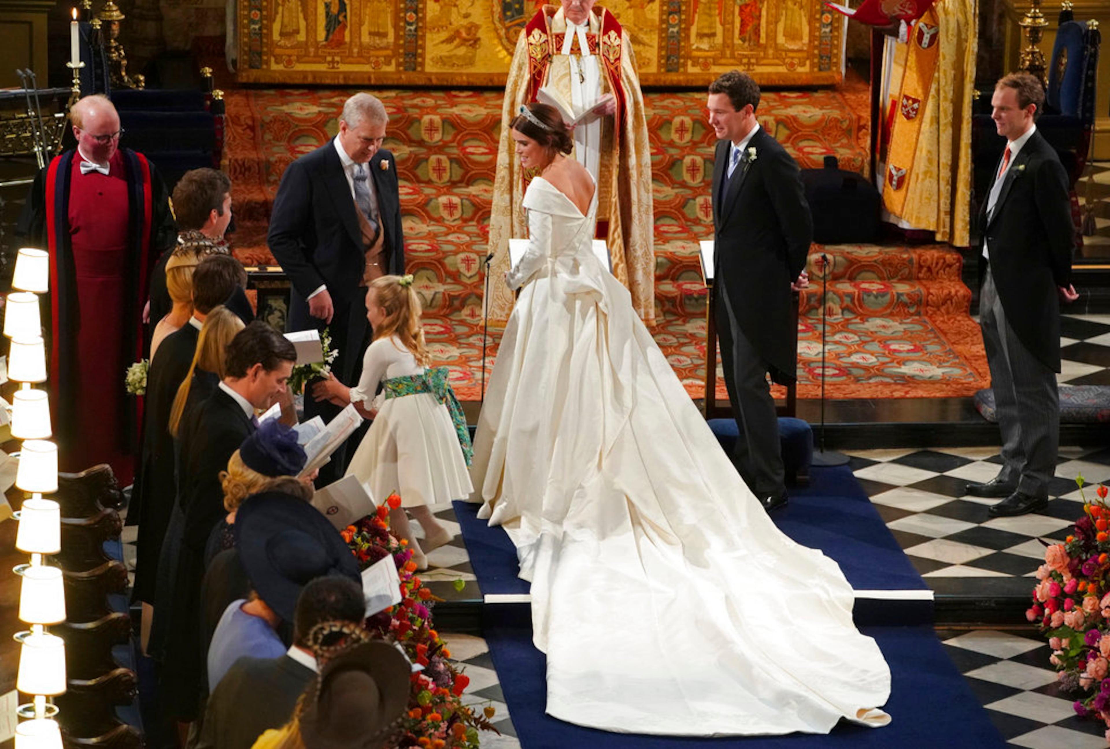The Duke of York and and Princess Eugenie of York arrive for her wedding to Jack Brooksbank, second right, in St Georgeâs Chapel, Windsor Castle, near London, England, Friday Oct. 12, 2018. (Owen Humphreys, Pool via AP)