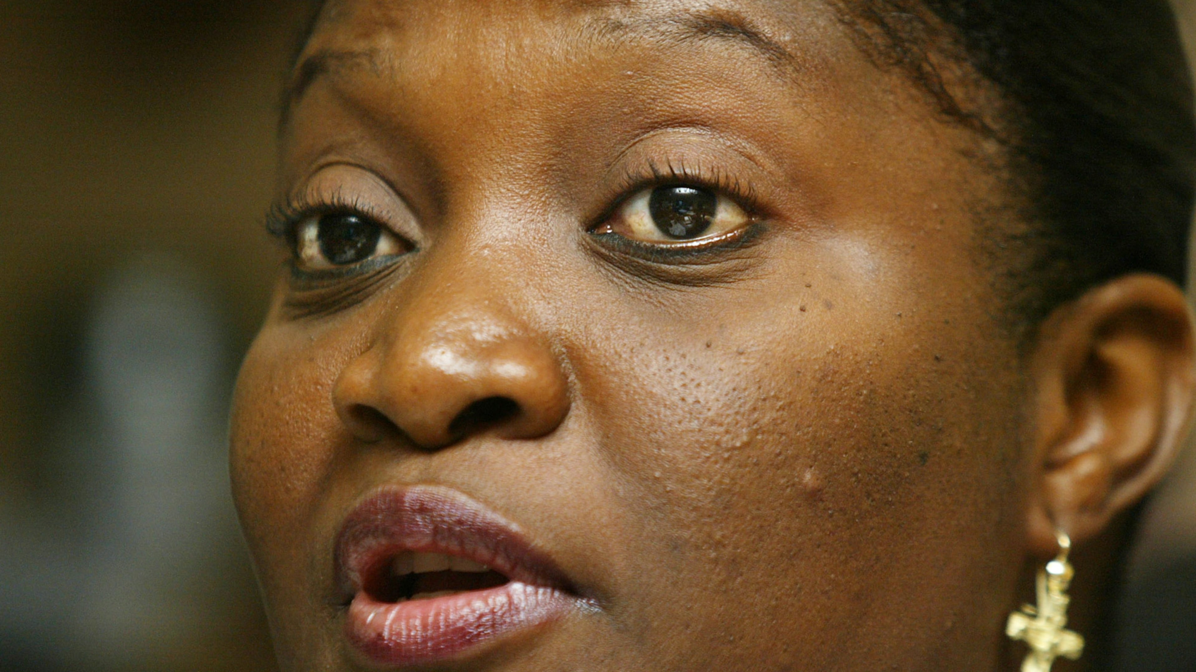 FILE - Liberian first lady Jewel Howard Taylor speaks to journalists at the ruling National Patriotic Party headquarters in the Liberian capital Monrovia Friday, July 11, 2003. (AP Photo/Ben Curtis,File)