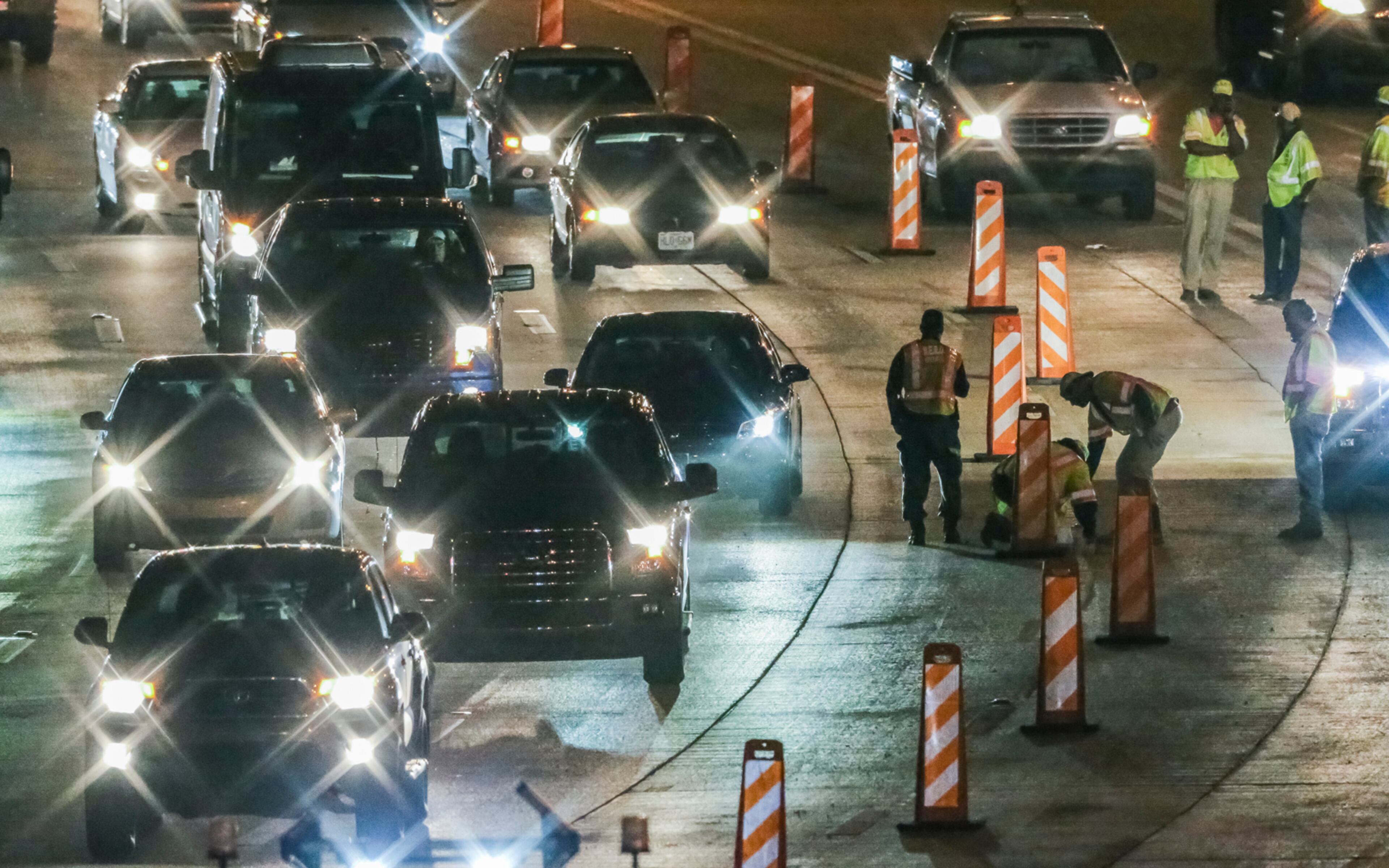April 18, 2017 DeKalb County: GDOT workers put on finishing touches before reopening ahead of schedule, all westbound lanes of I-20 Tuesday morning, April 18, 2017 after a damaged gas line caused part of the interstate to buckle Monday in DeKalb County. Georgia Department of Transportation officials originally said repairs between Candler and Gresham roads, where the damage occurred, would not be completed until noon Tuesday. However, crews worked through the night and finished those repairs about 6:30 a.m.- just before the morning rush. They will return later to stripe the interstate. "We wanted to open all lanes as soon as possible, so we used temporary tape to mark the lanes this morning," GDOT engineer Kathy Zahul said. "Crews will return when traffic volumes are lower to place the permanent lane striping." Initially, DeKalb fire officials thought the road failure was related to an underground gas leak. But DeKalb fire Capt. Eric Jackson said Tuesday "it had nothing to do with any gas." A private contractor was filling an old, 36-inch gas line under the interstate with concrete to seal the line. Pressure built and caused the road to buckle, Jackson said. A motorcyclist was tossed in the air. He was in critical condition Tuesday, Jackson said. The expedited reopening of I-20 West did not solve all traffic woes. Just as officials wrapped repairs Tuesday morning, a crash blocked right lanes on I-20 West near Boulevard, according to the WSB 24-hour Traffic Center. JOHN SPINK /JSPINK@AJC.COM