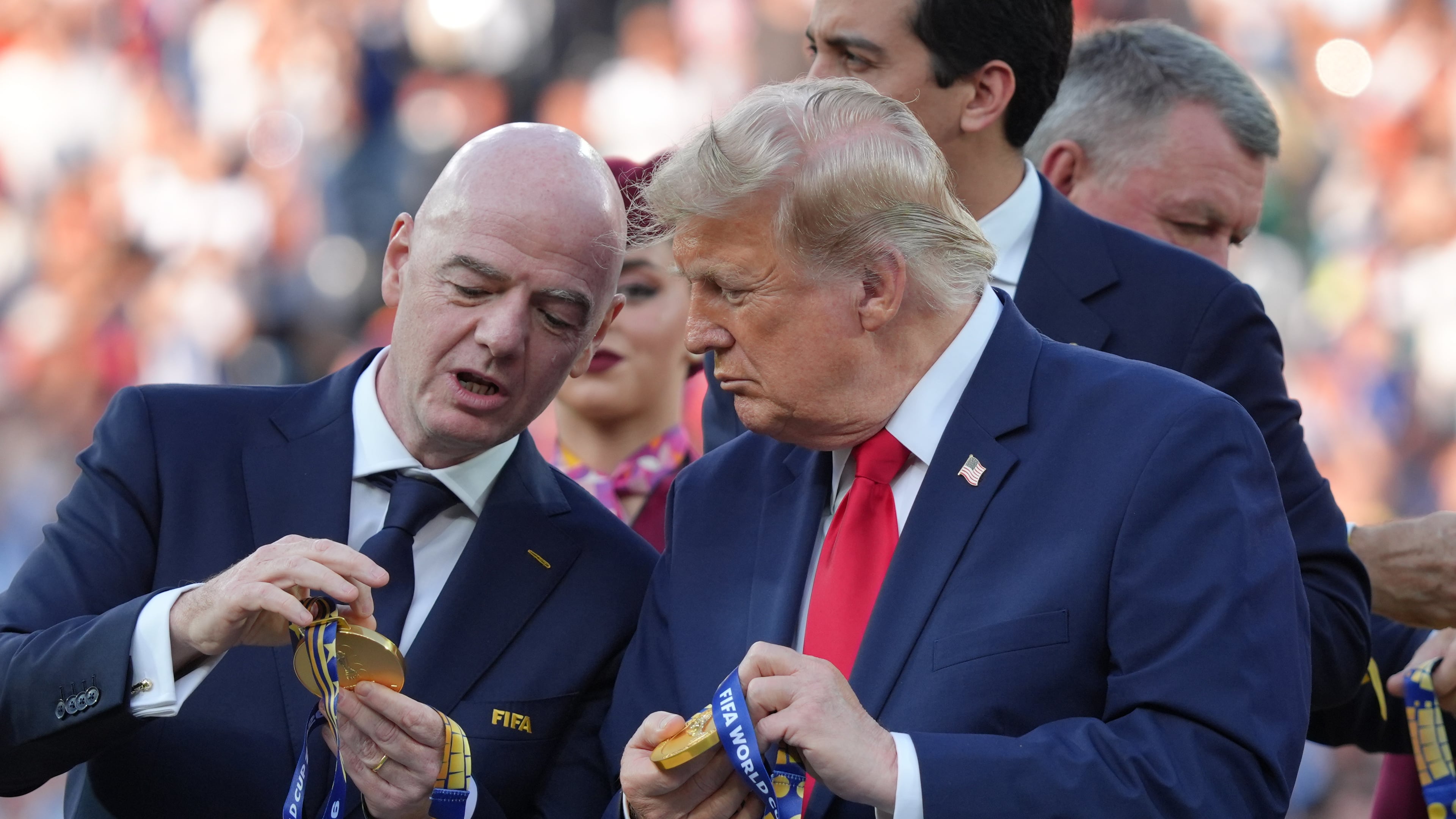 FIFA President Gianni Infantino, left, and President Donald Trump comment on the medals as they wait to congratulate the Spanish players after the World Cup final soccer match between Spain and Argentina in East Rutherford, N.J., near New York, Sunday, July 19, 2026. (AP Photo/Jacquelyn Martin)
