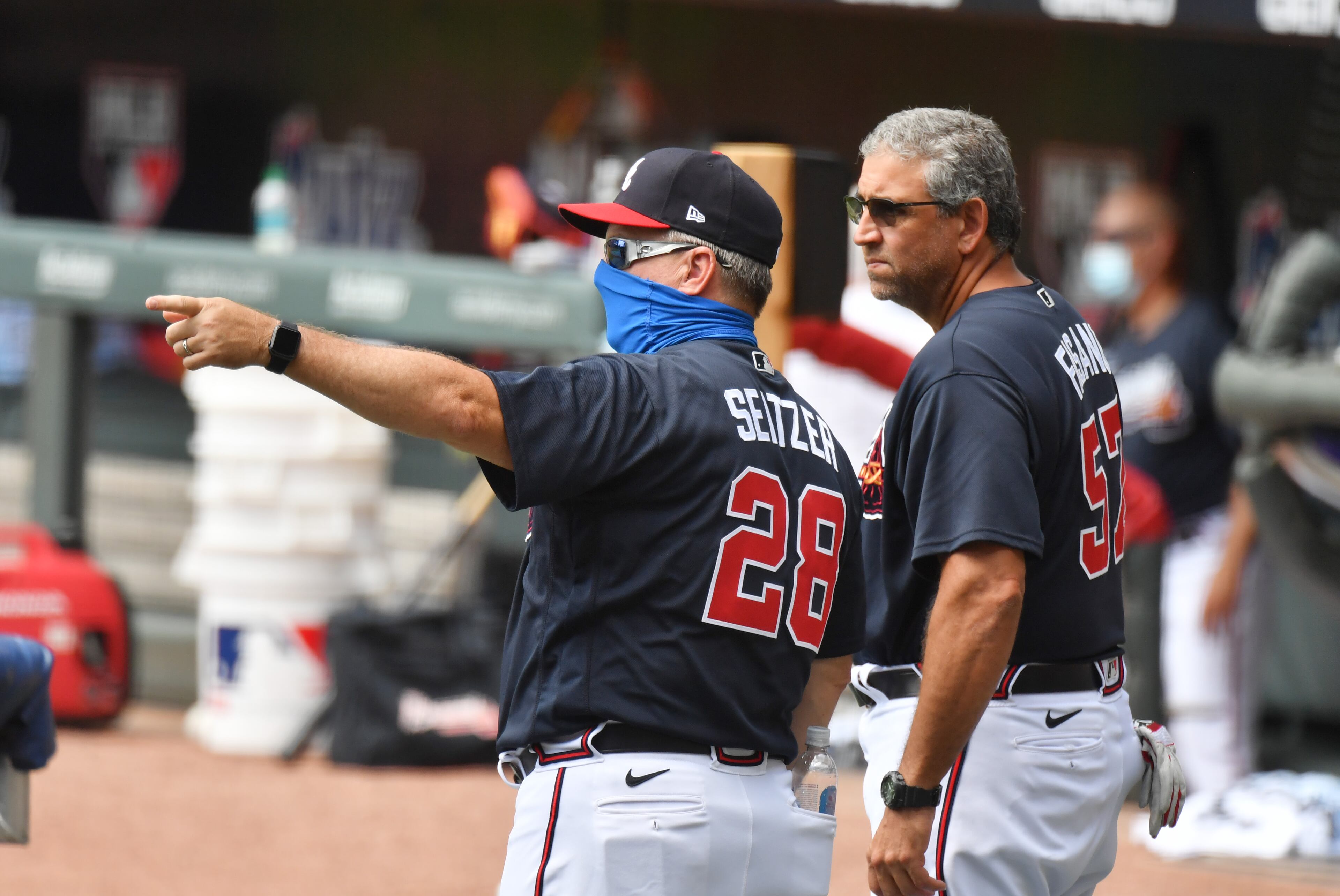 Braves hitting coach Kevin Seitzer (left) and catching coach Sal Fasano talk. (Hyosub Shin / Hyosub.Shin@ajc.com)