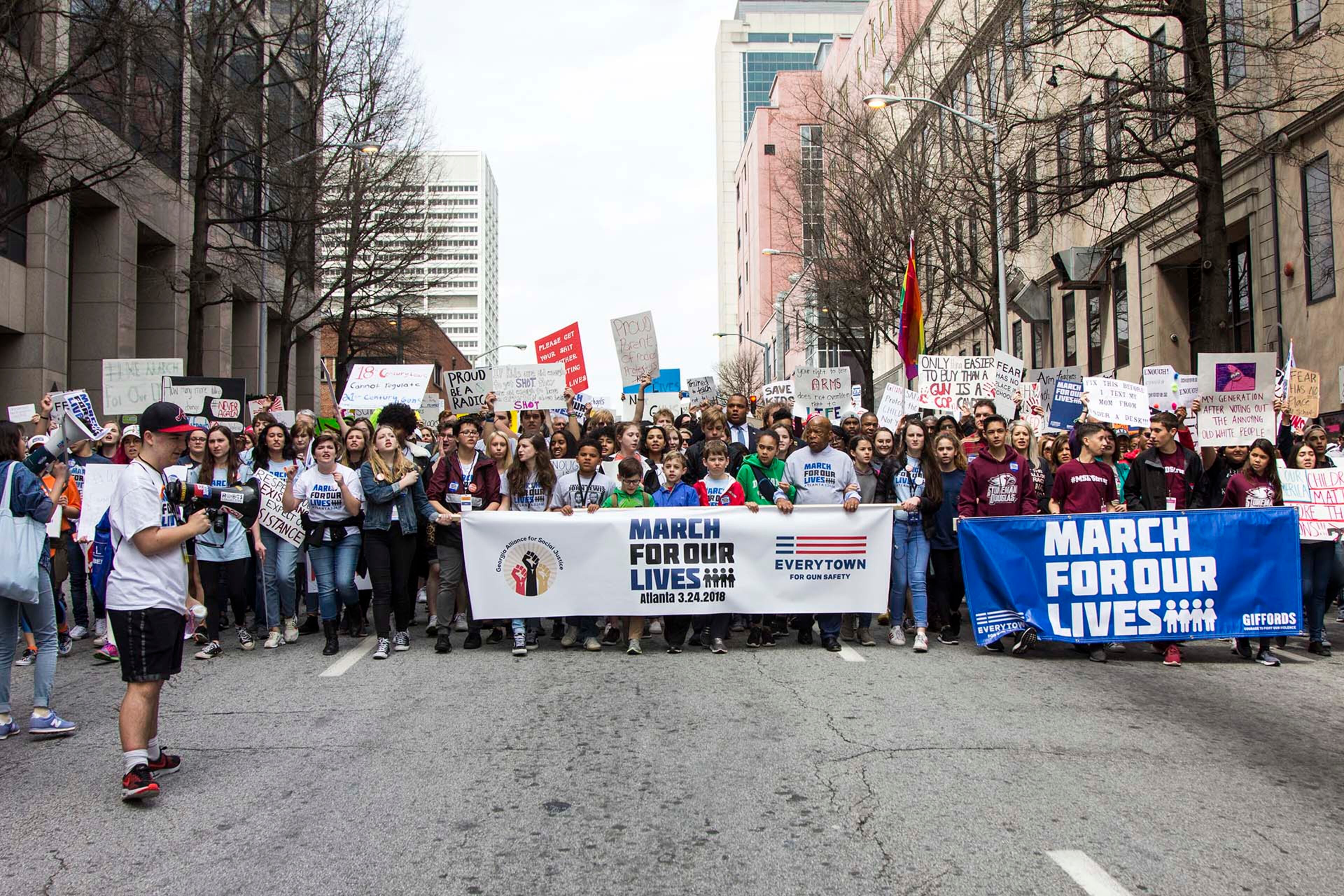 People march through the streets of Atlanta during the March for our Lives event in Atlanta, Georgia, on Saturday, March 24, 2018. (REANN HUBER/REANN.HUBER@AJC.COM)