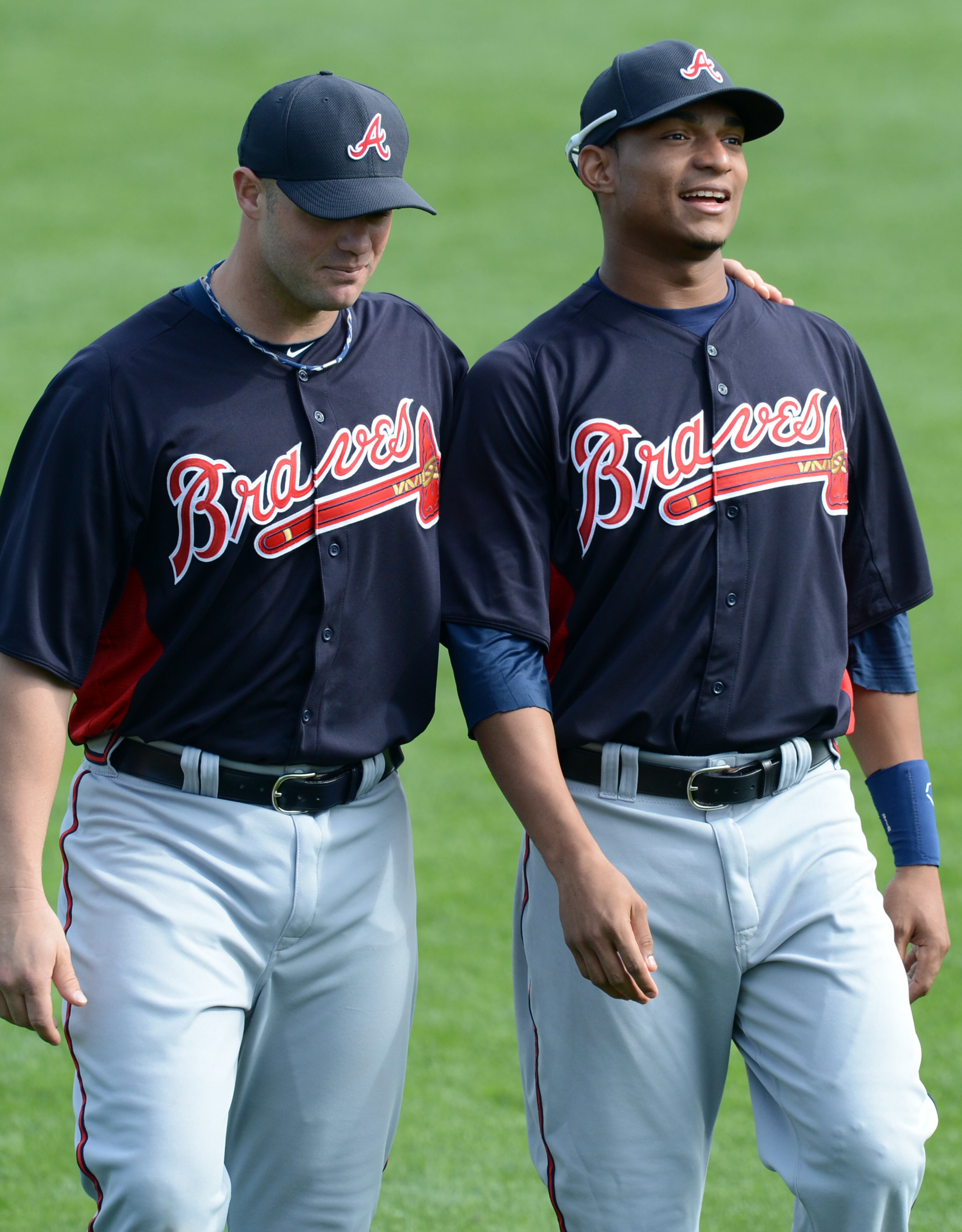 Braves catchers Evan Gattis (left) and Christian Bethancourt chat in 2013.
