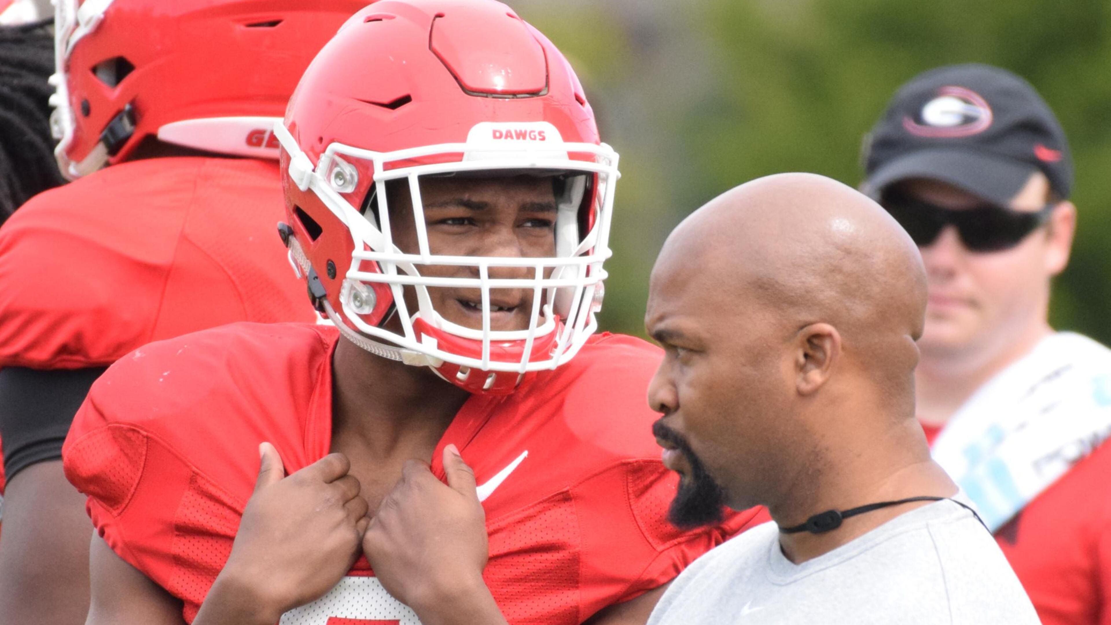 Georgia tailback Zamir White and running backs coach Dell McGee watch the Bulldogs' practice. (Photo by Steven Colquitt / University of Georgia)
