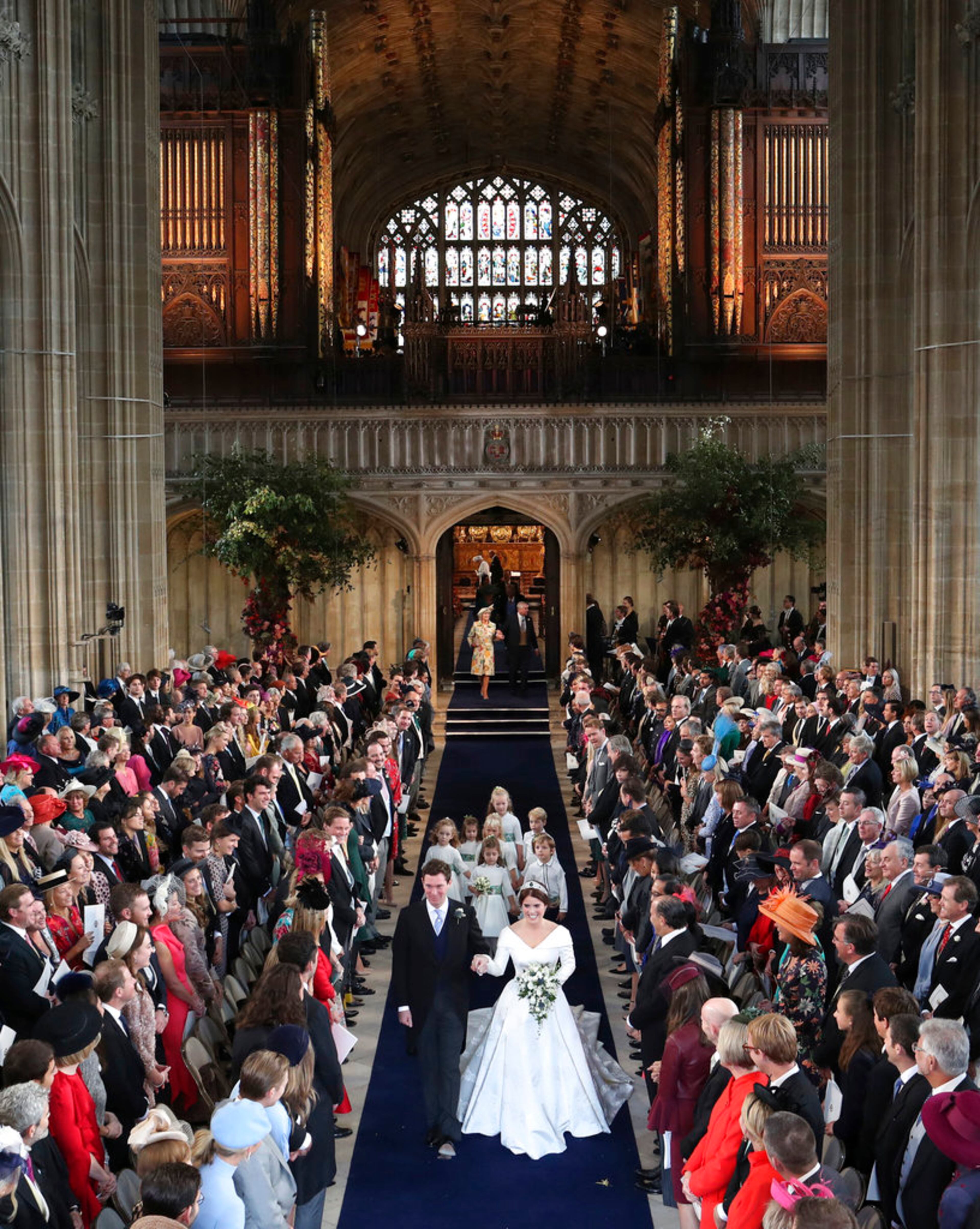 Princess Eugenie and Jack Brooksbank walk down the aisle after they were married in St Georgeâs Chapel, Windsor Castle, near London, England, Friday Oct. 12, 2018. (Danny Lawson, Pool via AP)