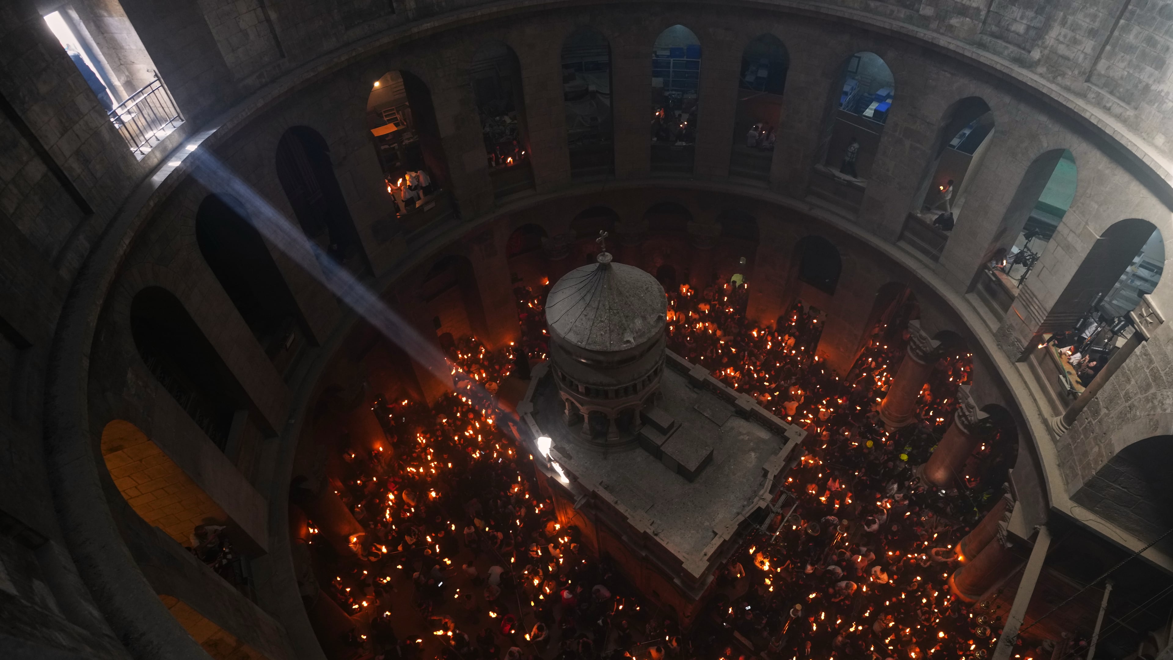 FILE - Christian Orthodox pilgrims hold up candles during the Holy Fire ceremony, at the Church of the Holy Sepulcher in the Old City of Jerusalem, Saturday, April 11, 2026. (AP Photo/Mahmoud Illean, File)