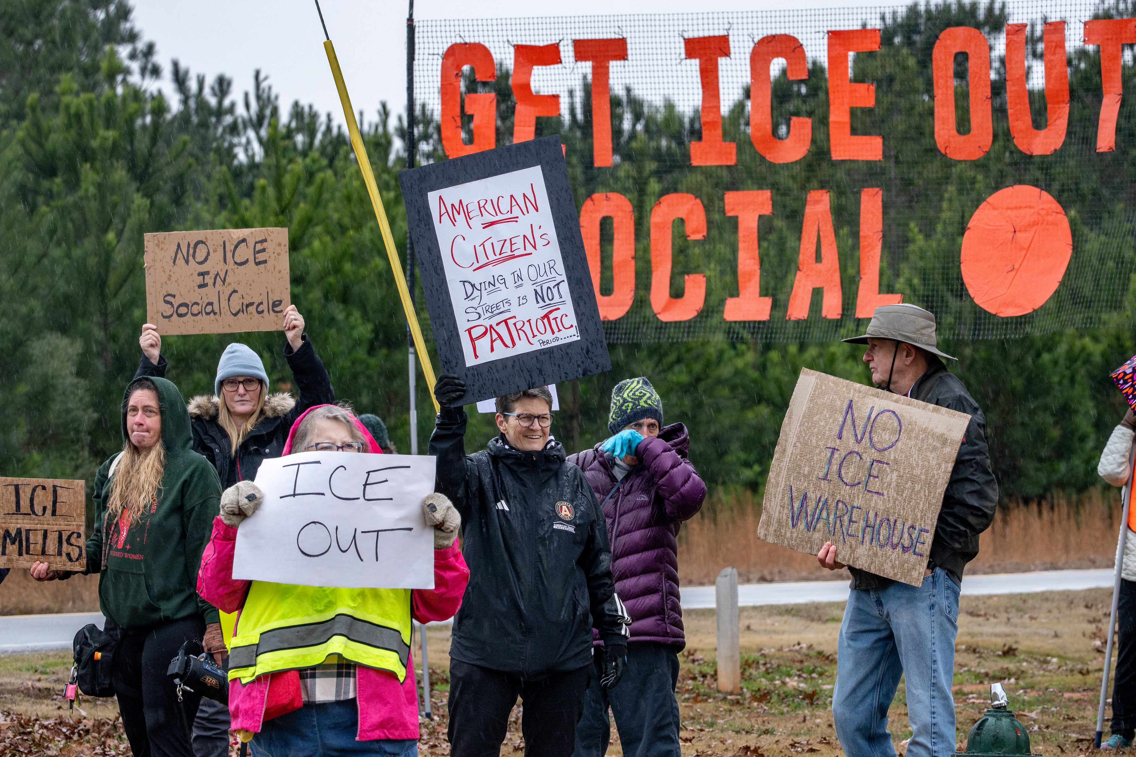 Anti-ICE protesters gather on Social Circle Parkway in the city of Social Circle, Ga., to voice opposition to potential Immigration and Customs Enforcement facility. Wednesday, Jan 14, 2026. (Ben Hendren/AJC)