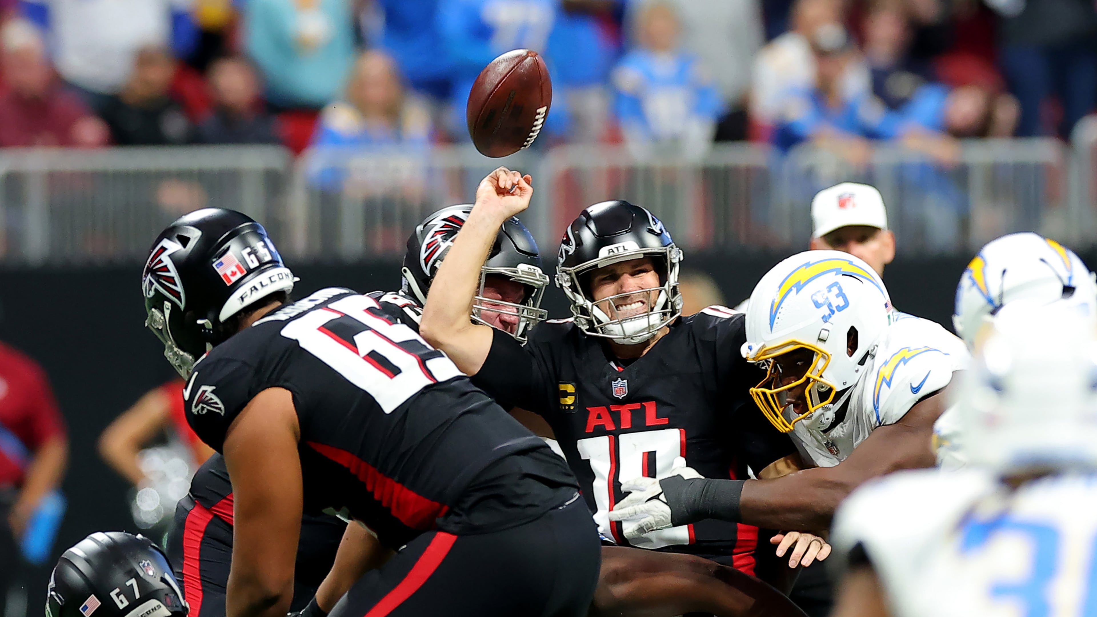 Otito Ogbonnia (93) of the Los Angeles Chargers forces a fumble against Kirk Cousins (18) of the Atlanta Falcons during the fourth quarter at Mercedes-Benz Stadium on Sunday, Dec. 1, 2024, in Atlanta. (Kevin C. Cox/Getty Images/TNS)