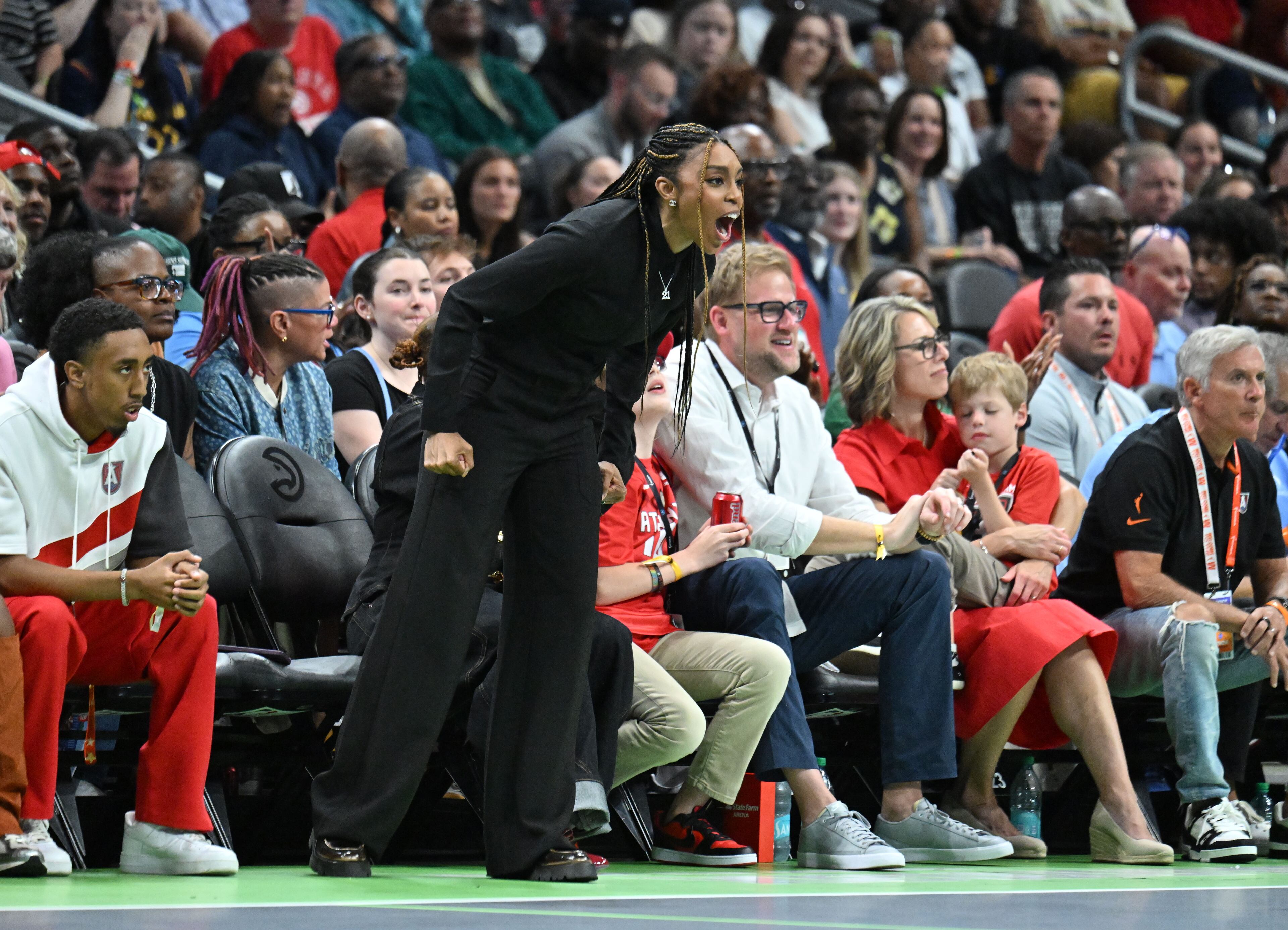 Fans cheer during Atlanta Dream’s home opener against Indiana Fever at State Farm Arena, Thursday, May 22, 2025, in Atlanta. (Hyosub Shin / AJC)