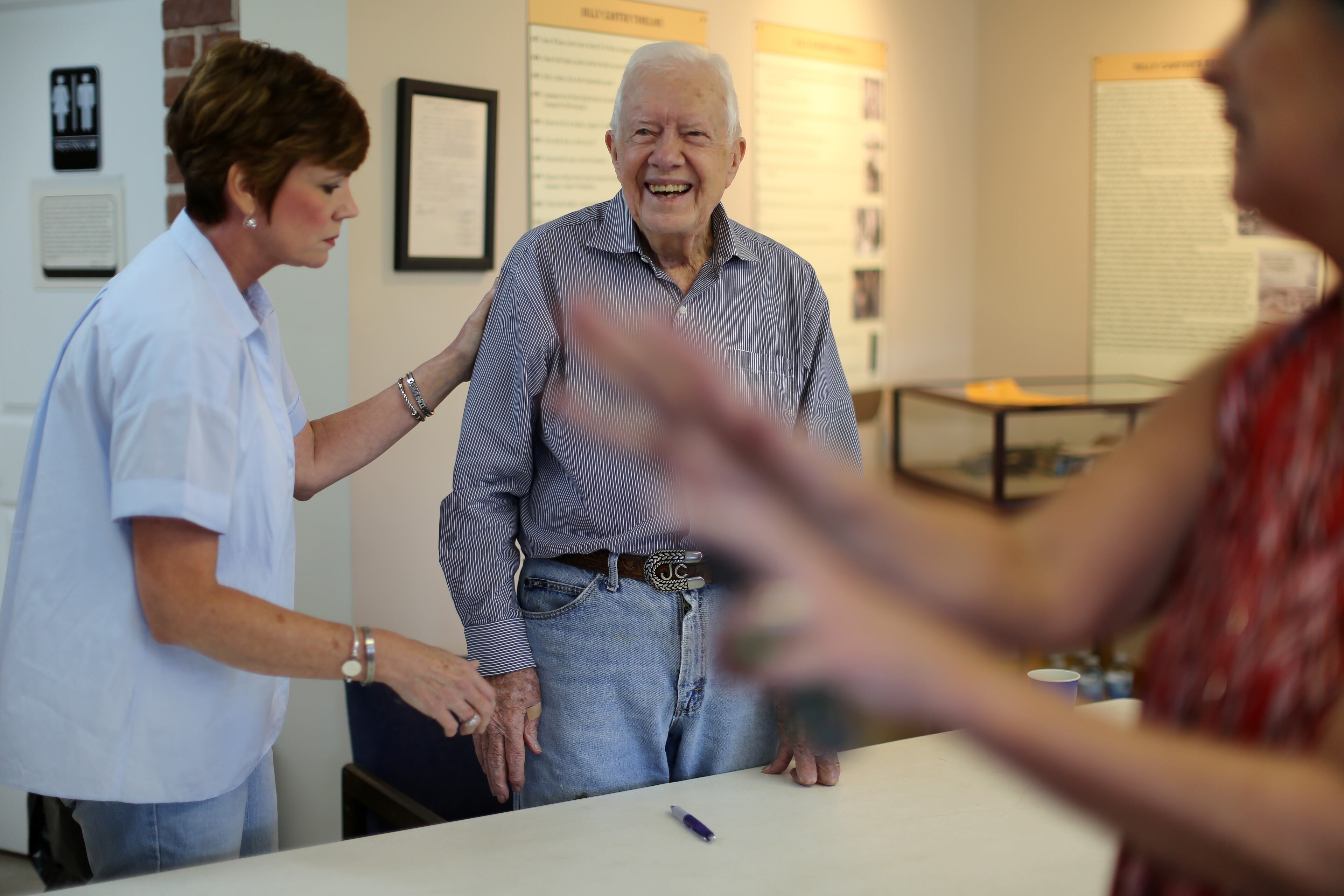 September 26, 2015 Plains: Polly Martin, left, the Carter's assistant in Plains, checks on former President Jimmy Carter at the end of a book signing event Saturday afternoon September 26, 2015 during the Peanut Festival. The consensus among Plains residents was that it was the largest crowd ever for the festival. Ben Gray / bgray@ajc.com