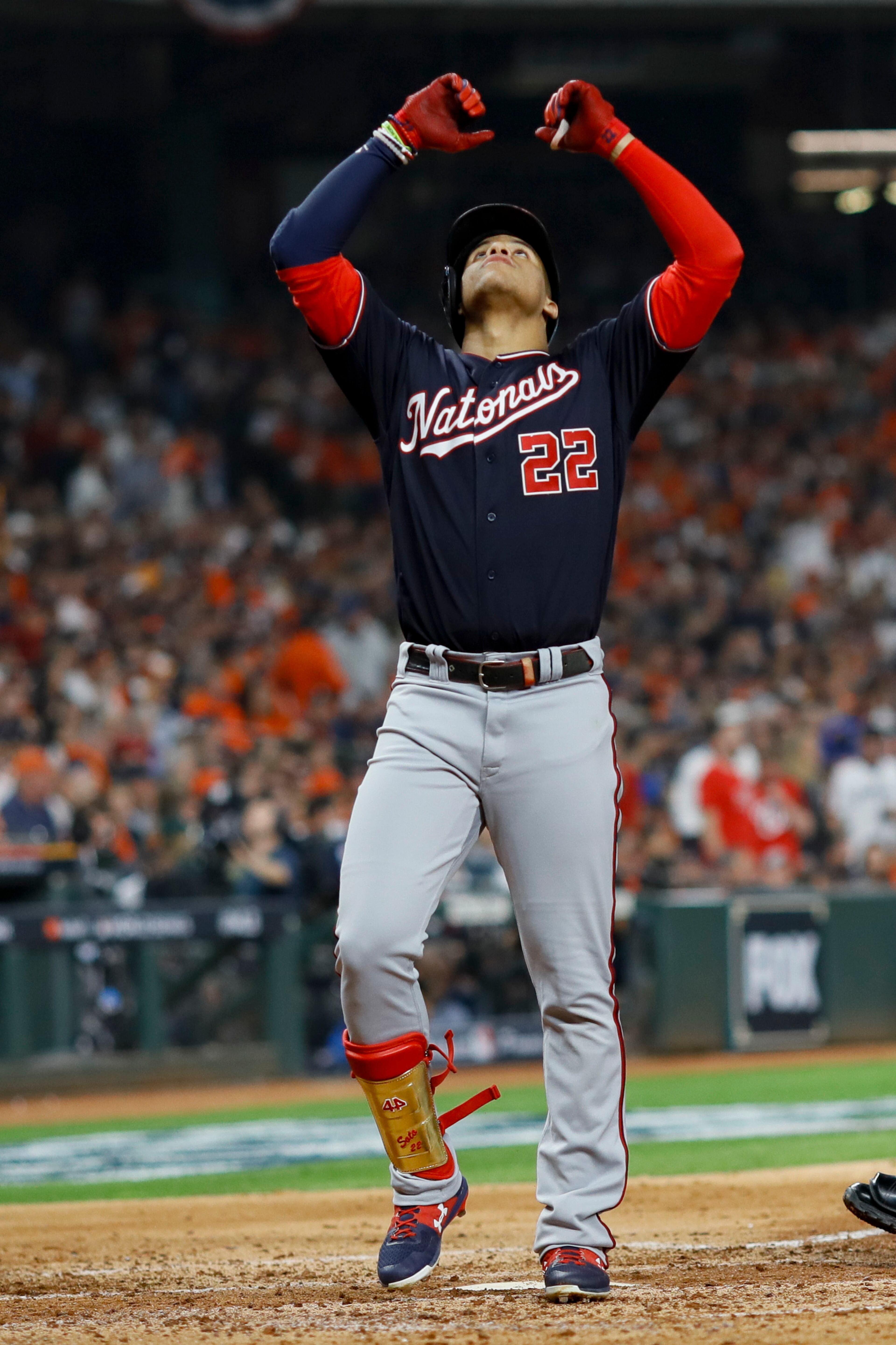 Washington Nationals' Juan Soto celebrates in the dugout after his home run against the Houston Astros during the fourth inning of Game 1 of the baseball World Series Tuesday, Oct. 22, 2019, in Houston. (AP Photo/Matt Slocum)
