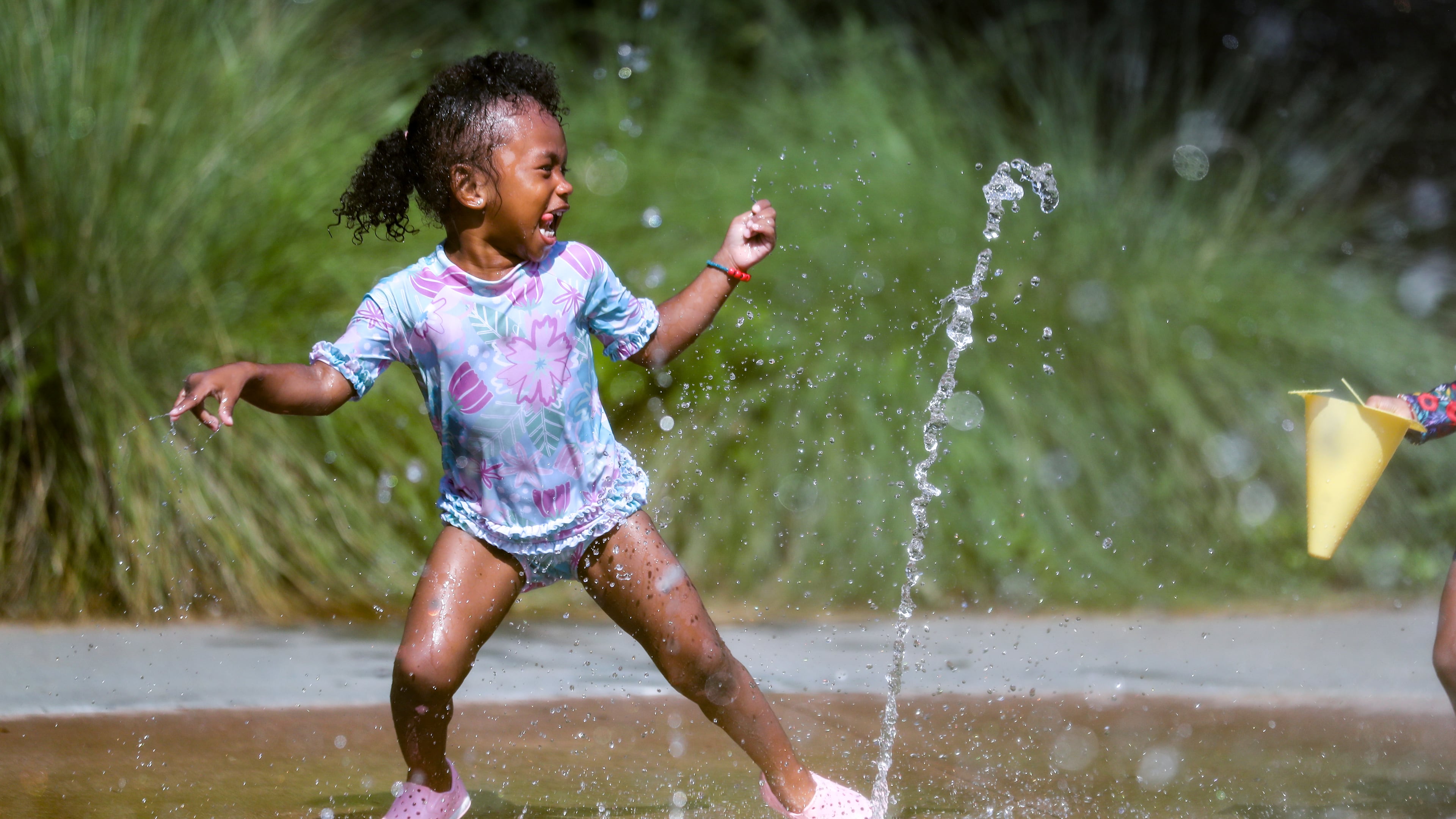 June 13, 2022 Atlanta: Layla Hall-2 didn’t pay any attention to the heat index on Monday, June 13, 2022 as she frolicked in the water at the Historic Fourth Ward Park Splash Pad in Atlanta. (John Spink / John.Spink@ajc.com)