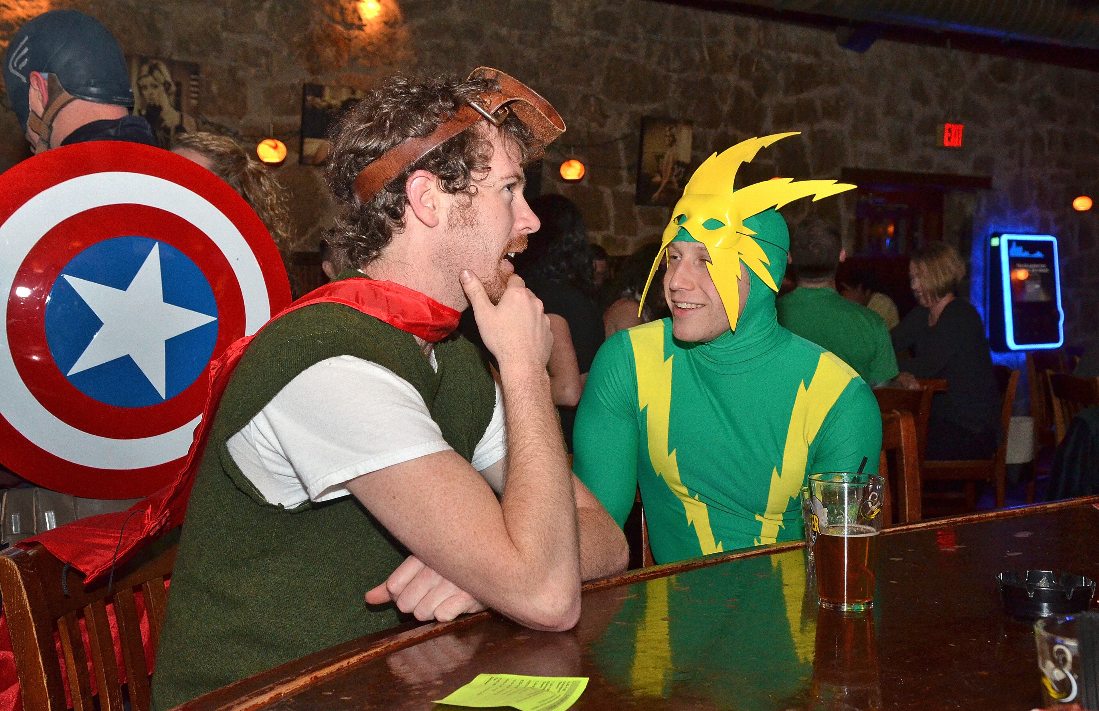 Atlanta, Ga (East Atlanta Village): Jeremy Arnold (left) and Eli Mazer aka Quail Man and Electro, enjoy the evening and a cool pint at the Glenwood Bar during the Superhero and Supervillain Pub Crawl Saturday night in East Atlanta Village. The 5th annual Superhero and Supervilllain Pub Crawl! Fundraiser in Atlanta's East Atlanta Village Saturday March 7, 2015. The event, which started as a birthday celebration with a handful of friends wearing costumes, has steadily grown into the fundraiser it is today. The event sponsored by Budweiser and sales of wristbands benefit PAWS Atlanta, a private not-for-profit animal welfare organization. (Chris Hunt/Special)