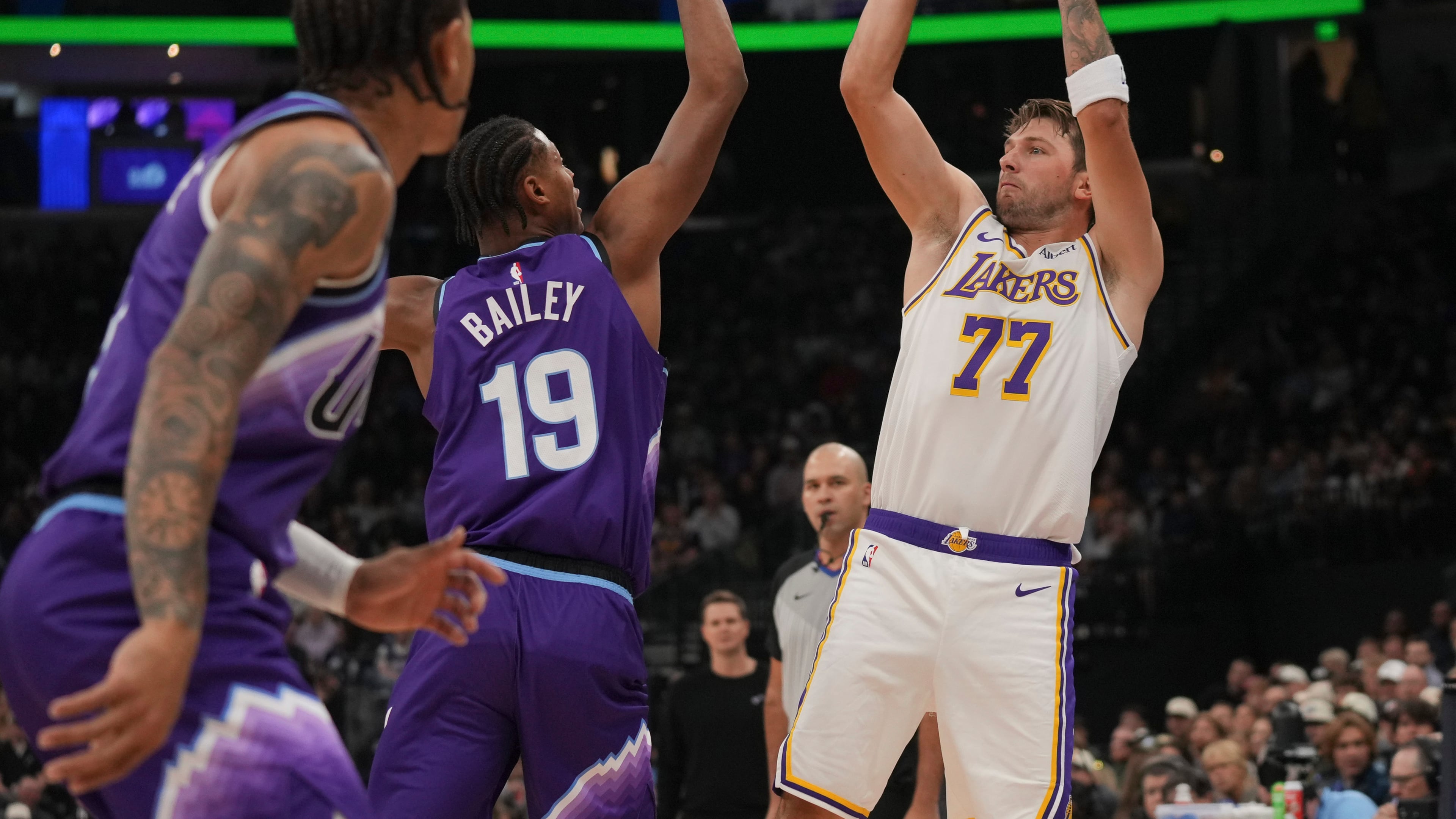 Los Angeles Lakers forward/guard Luka Dončić (77) looks to shoots as Utah Jazz forward Ace Bailey (19) defends during the first half of an NBA basketball game Sunday, Oct. 25, 2026, in Salt Lake City. (AP Photo/Bethany Baker)