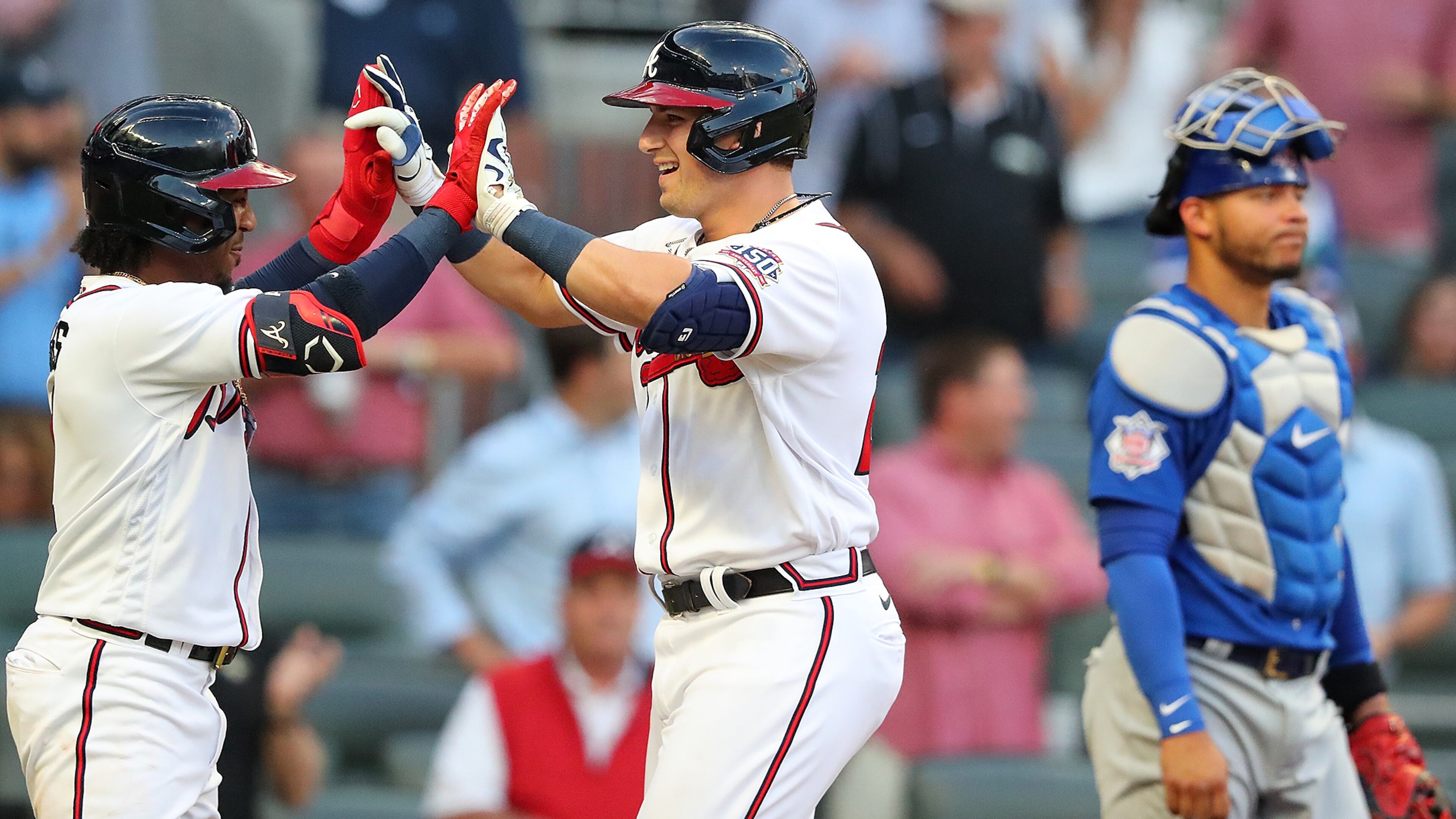 Braves third baseman Austin Riley celebrates with teammate Ozzie Albies after hitting a two-run home run against the Chicago Cubs during the first inning Wednesday, April 28, 2021, at Truist Park in Atlanta. (Curtis Compton / Curtis.Compton@ajc.com)