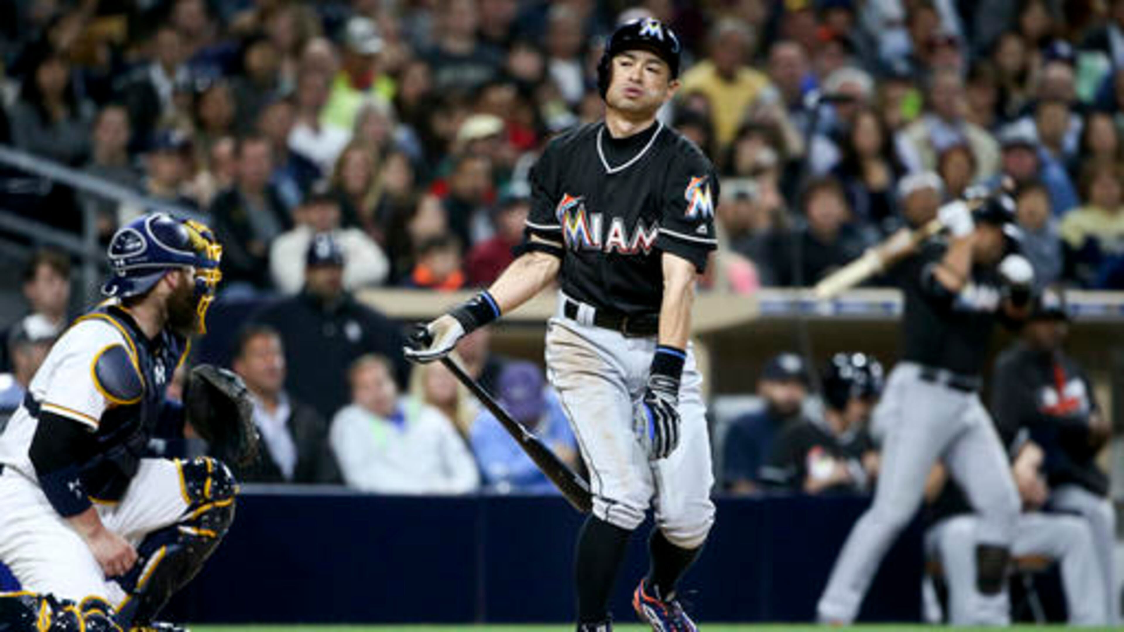 Miami Marlins' Ichiro Suzuki fouls off a pitch toward teammate Martin Prado in the on-deck circle while batting for a second time in the third inning against the San Diego Padres in a baseball game Monday, June 13, 2016, in San Diego. (AP Photo/Lenny Ignelzi)