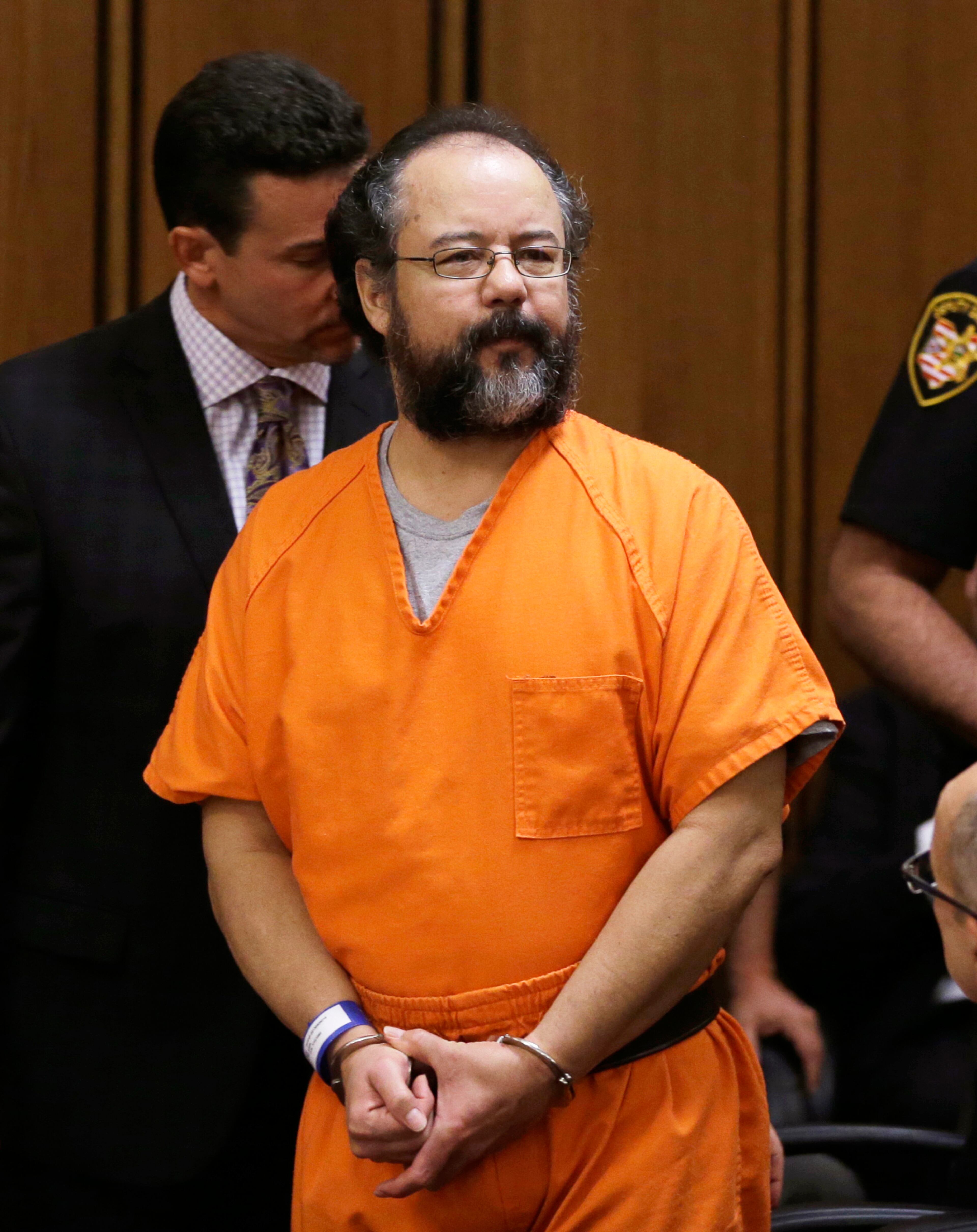 Ariel Castro enters the courtroom during the sentencing phase Thursday, Aug. 1, 2013, in Cleveland. Three months after an Ohio woman kicked out part of a door to end nearly a decade of captivity, Castro, a onetime school bus driver faces sentencing for kidnapping three women and subjecting them to years of sexual and physical abuse. (AP Photo/Tony Dejak)