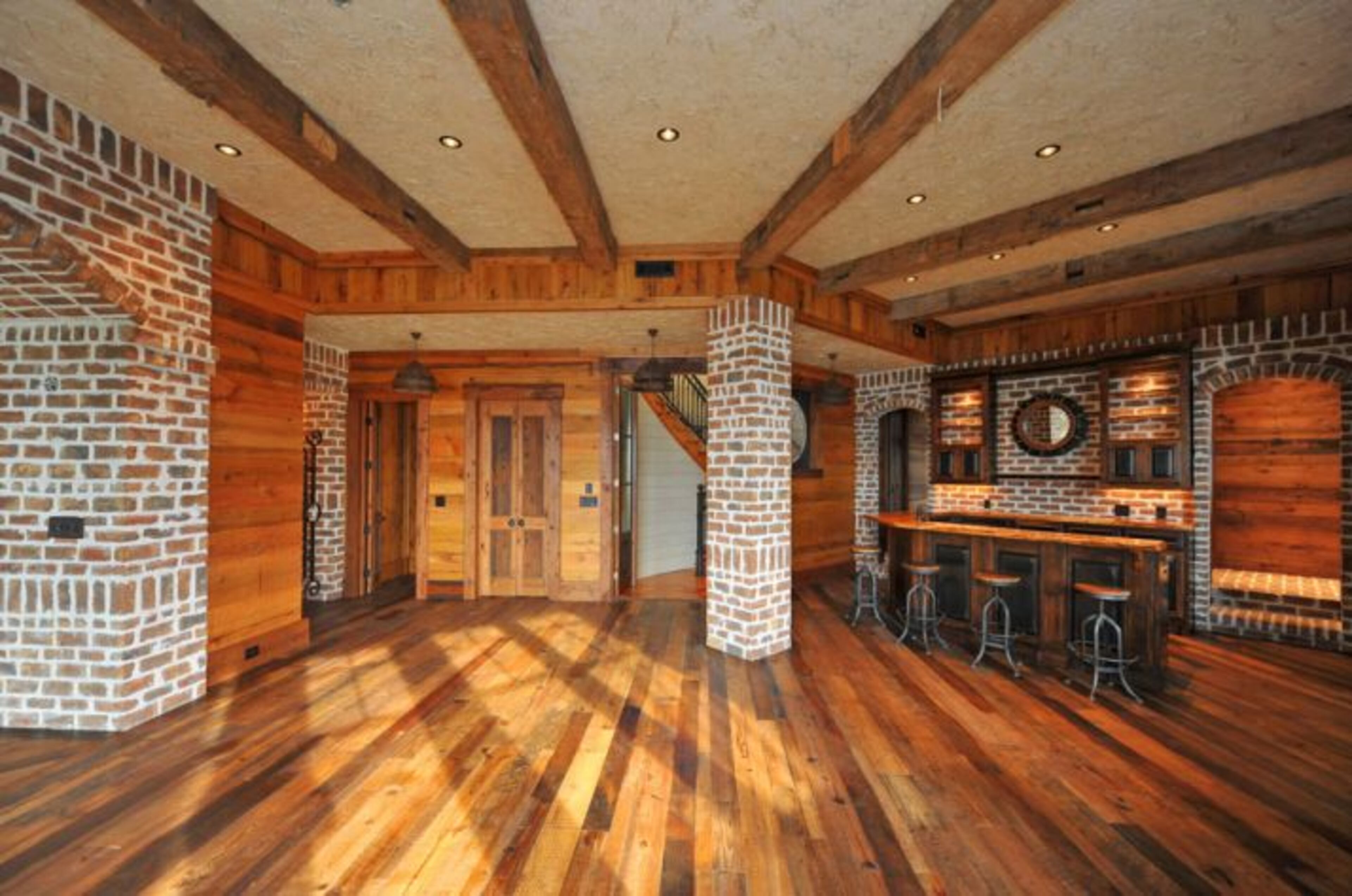 The floors throughout the home fashion reclaimed heart pine planks.