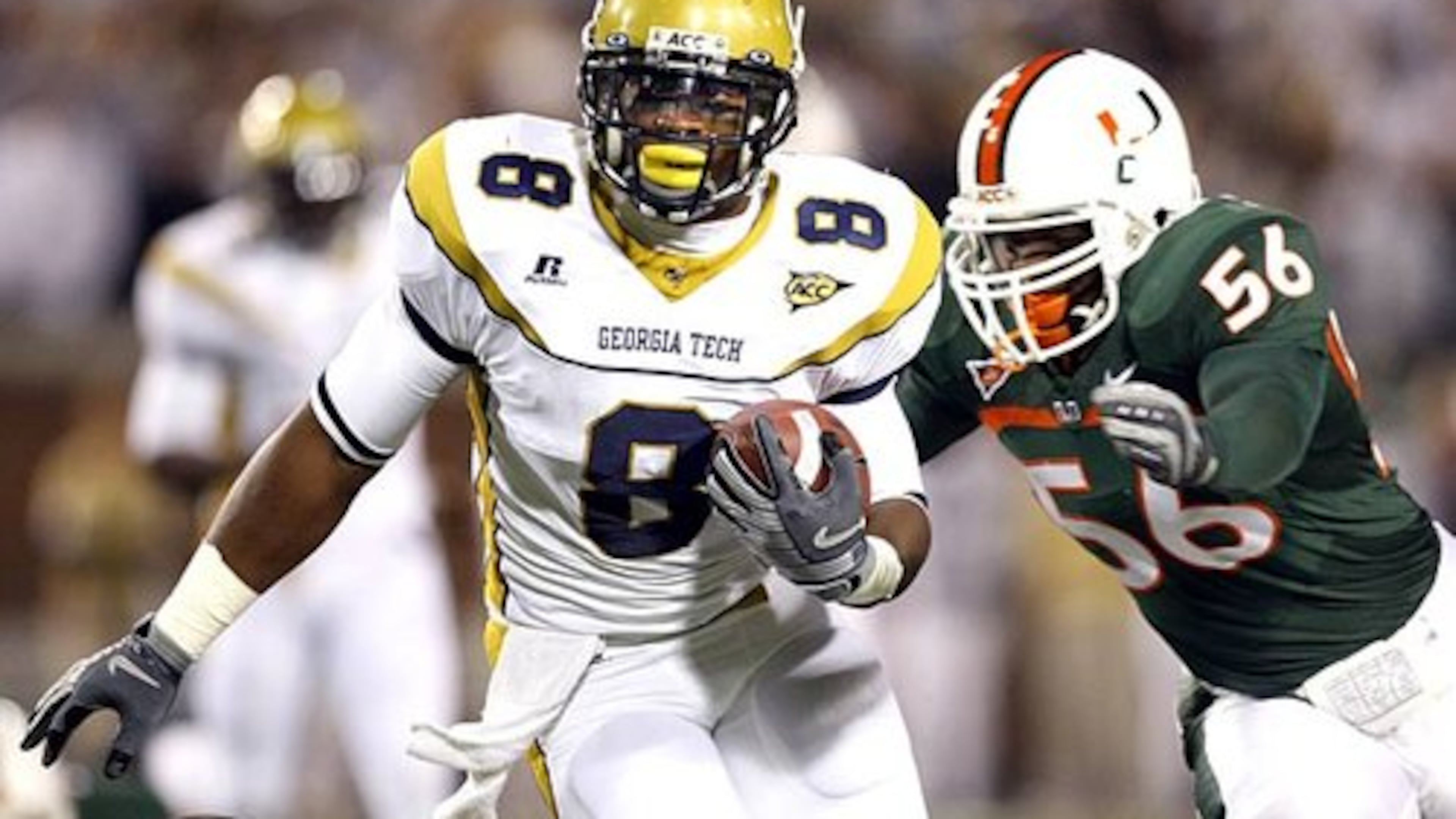 Georgia Tech wide receiver Demaryius Thomas (8) runs in the first quarter as Miami linebacker Marcus Robinson (56) tries to make the tackle.