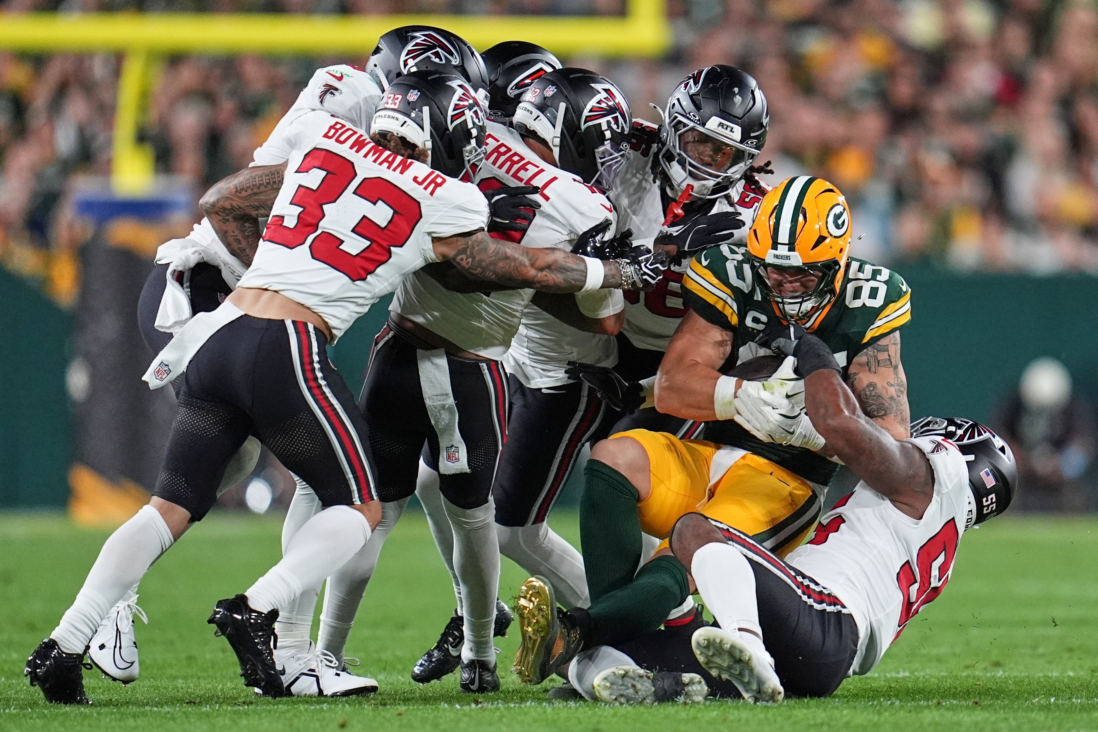 Green Bay Packers' Tucker Kraft is stopped after catching a pass during the first half of an NFL football game against the Atlanta Falcons in Green Bay, Wis., Thursday, Sept. 24, 2026. (AP Photo/Abbie Parr)