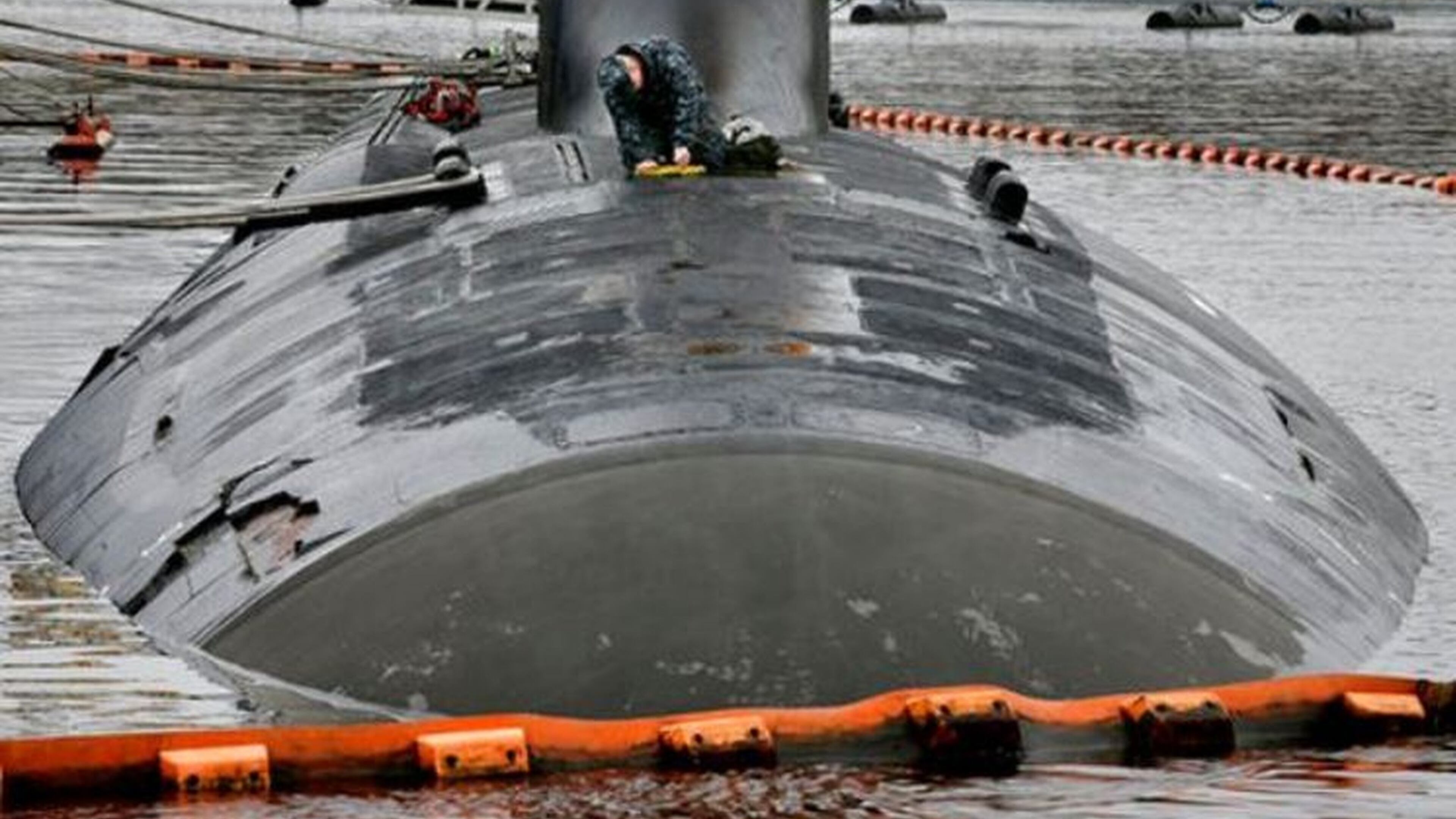 A member of the U.S. Navy performs maintenance on the submarine USS New Mexico on April 26, 2017, in Groton, Conn. (AP/Steven Senne)