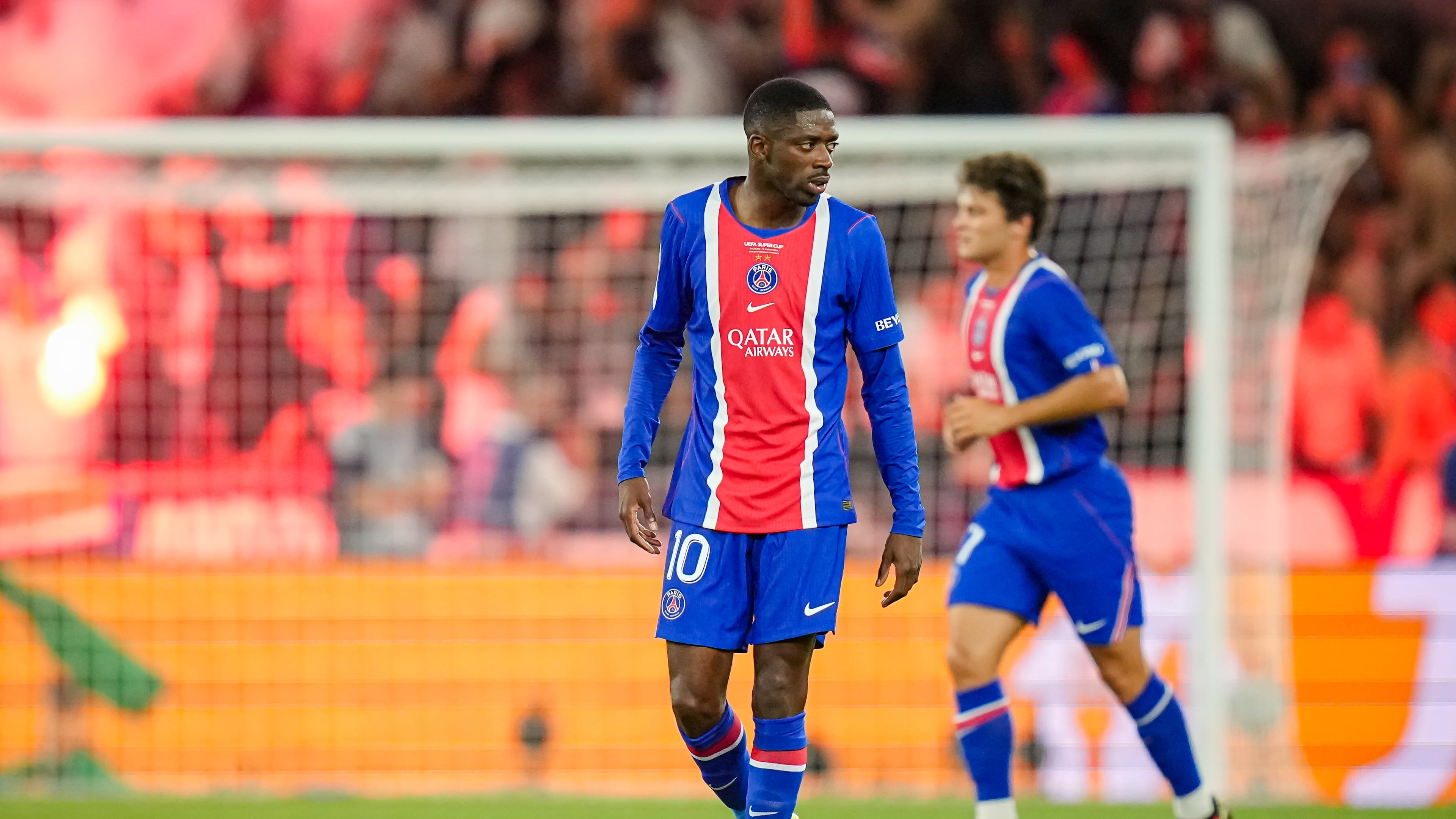 PSG's Ousmane Dembele reacts after PSG's Desire Doue scored his side's second goal during the UEFA Super Cup soccer match between Paris Saint-Germain and Aston Villa in Salzburg, Austria, Wednesday, Aug.12, 2026. (AP Photo/Darko Bandic)