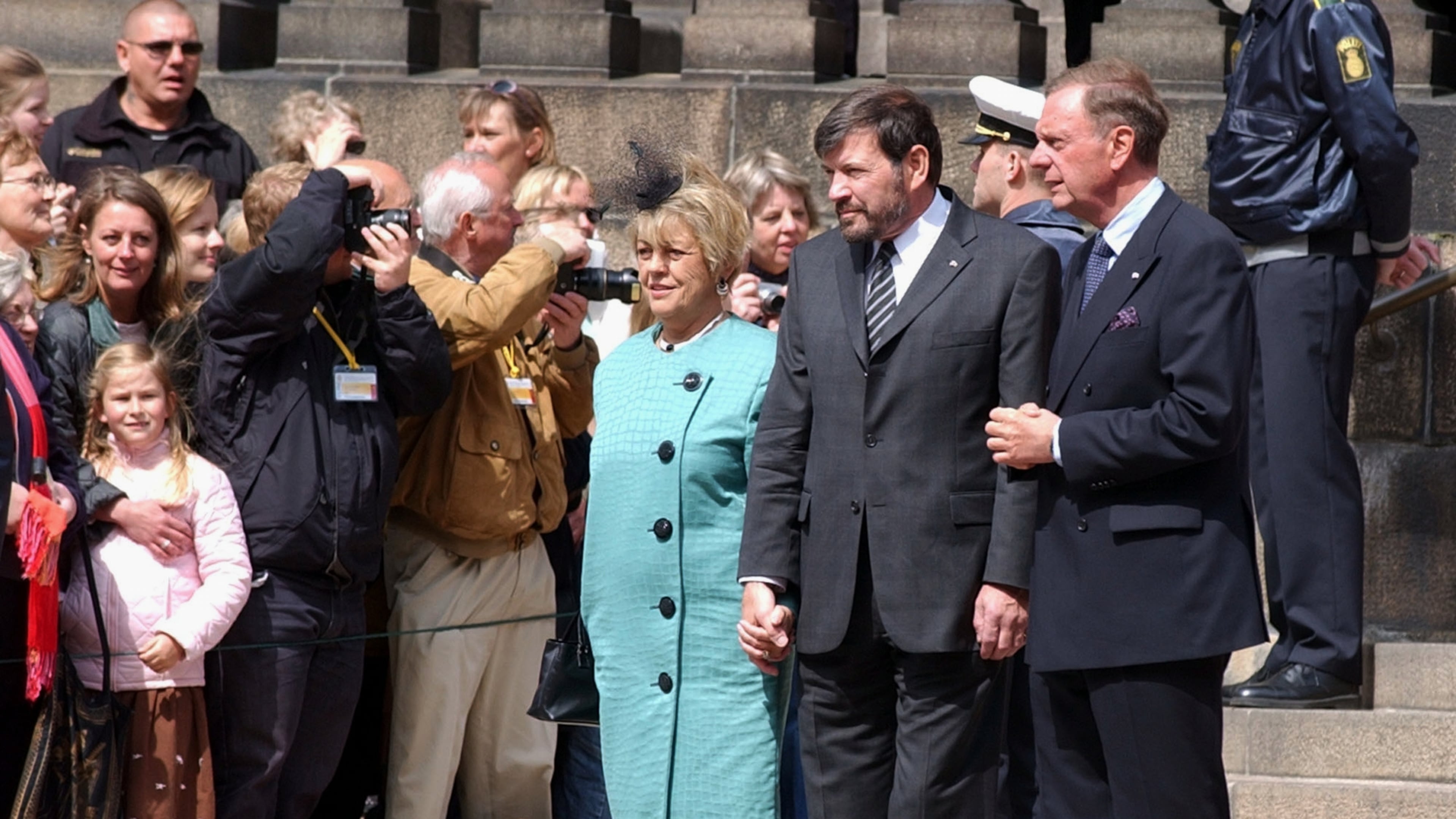 FILE - John Donaldson, center right, father of Mary Donaldson, the fiancée of Denmark’s Crown Prince Frederik, and his wife, Susan Moody, center left, speak to the crowd in front of the Danish Parliament in Copenhagen, May 13, 2004. (AP Photo/Virginia Mayo, File)