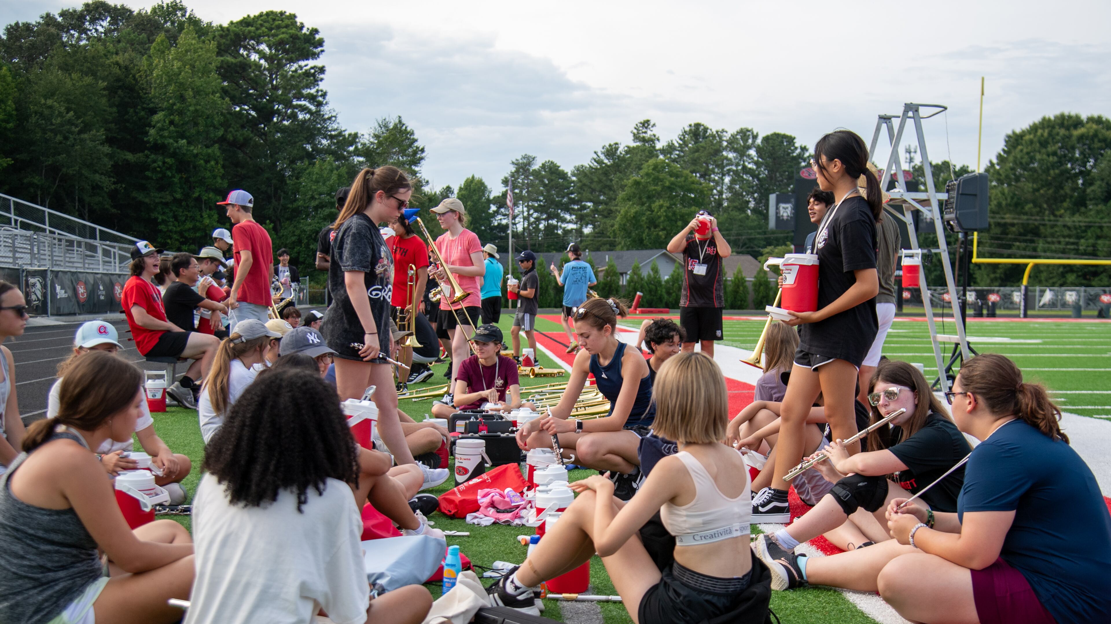 Scheduled water breaks help squash the heat during band practice at North Gwinnett High School on Wednesday, July 26, 2023. (Jamie Spaar for The Atlanta Journal-Constitution)