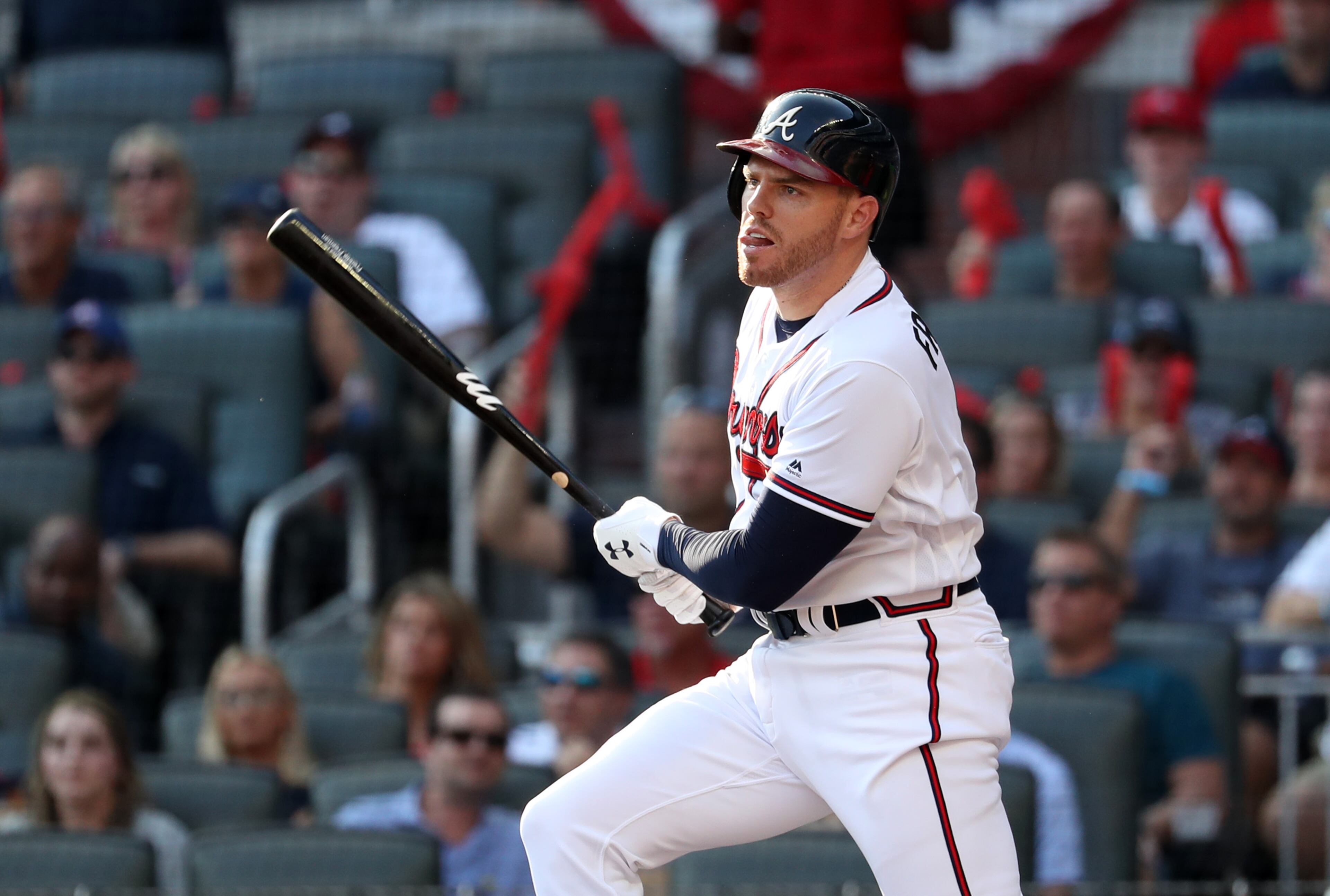Braves first baseman Freddie Freeman (5) hits a single in the first inning against the St. Louis Cardinals in Game 1 at SunTrust Park Thursday. (JASON GETZ/SPECIAL TO THE AJC)
