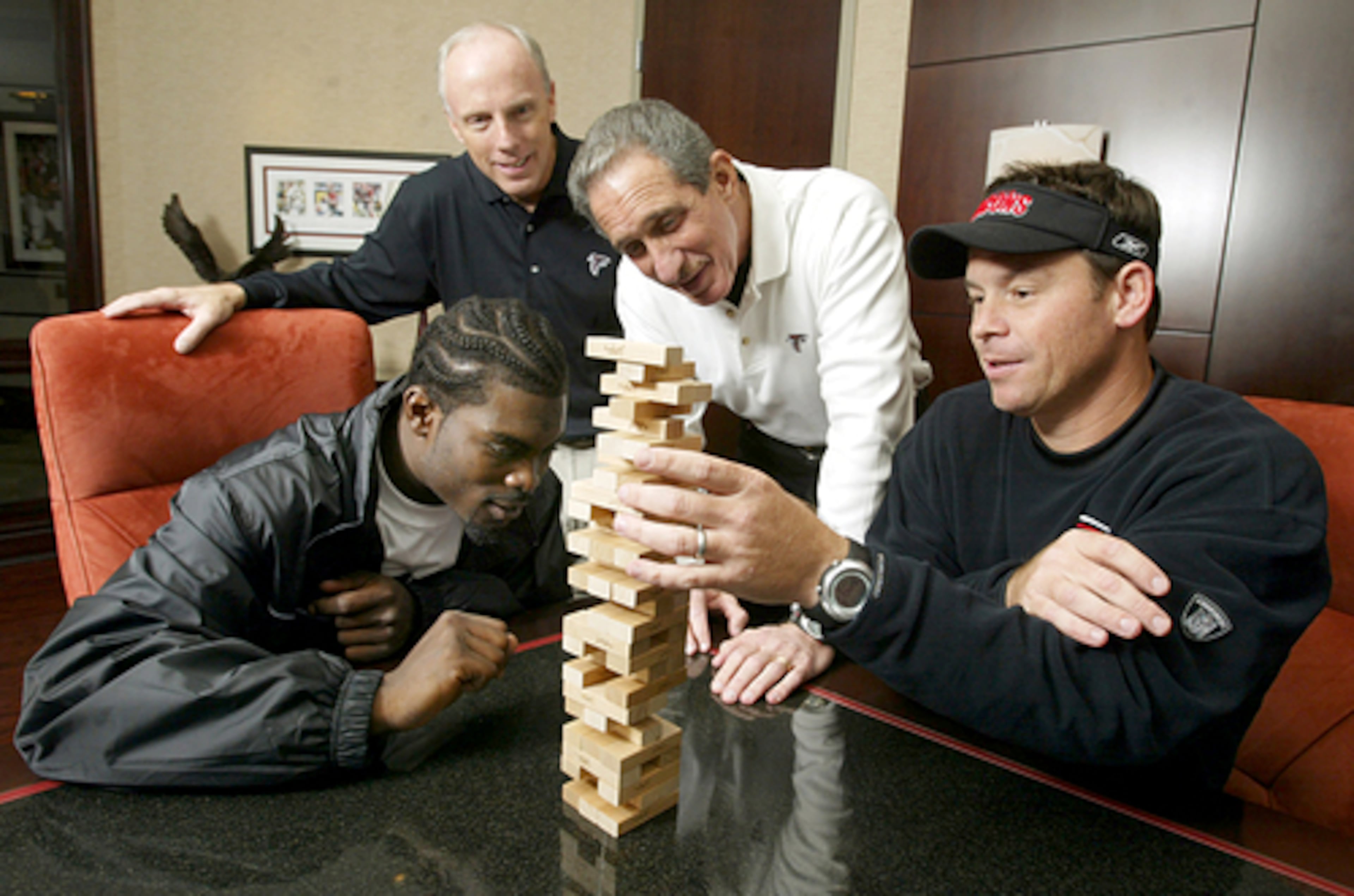 The Falcons credited their rebound from a 5-11 team to a contender to team-building between quarterback Michael Vick, general manager McKay, owner Blank and coach Mora.