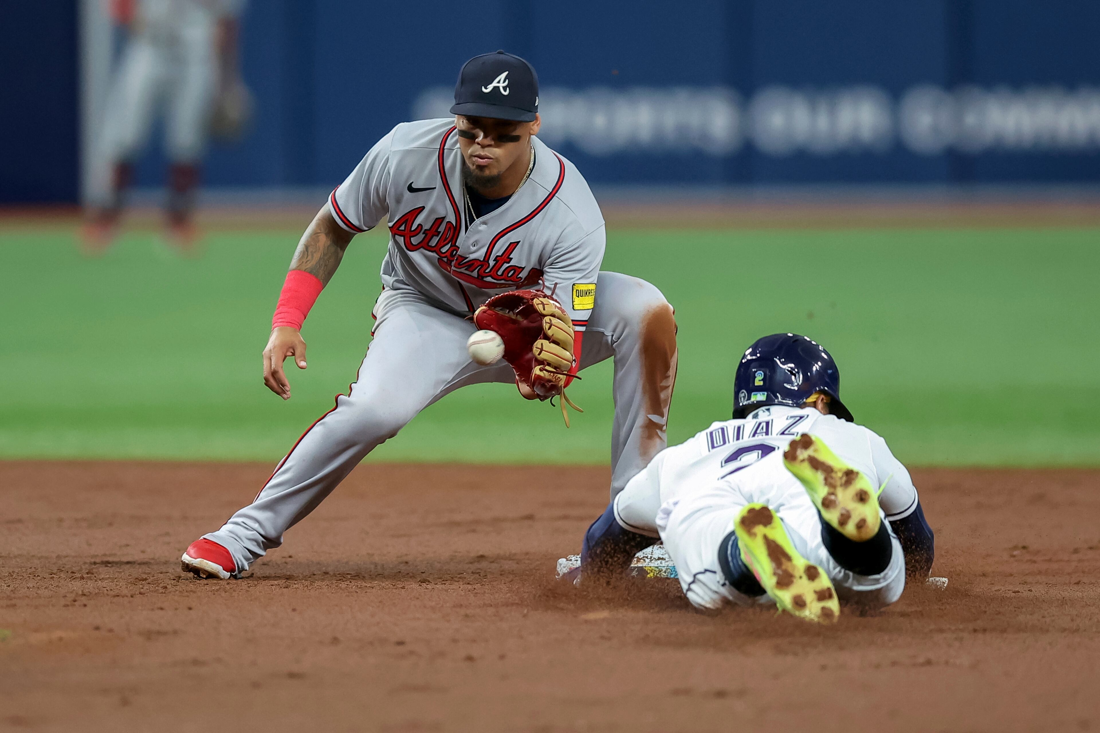 Atlanta Braves' Orlando Arcia waits for the throw before tagging out Tampa Bay Rays' Yandy Diaz on an attempted steal of second base during the third inning of a baseball game Friday, July 7, 2023, in St. Petersburg, Fla. (AP Photo/Mike Carlson)