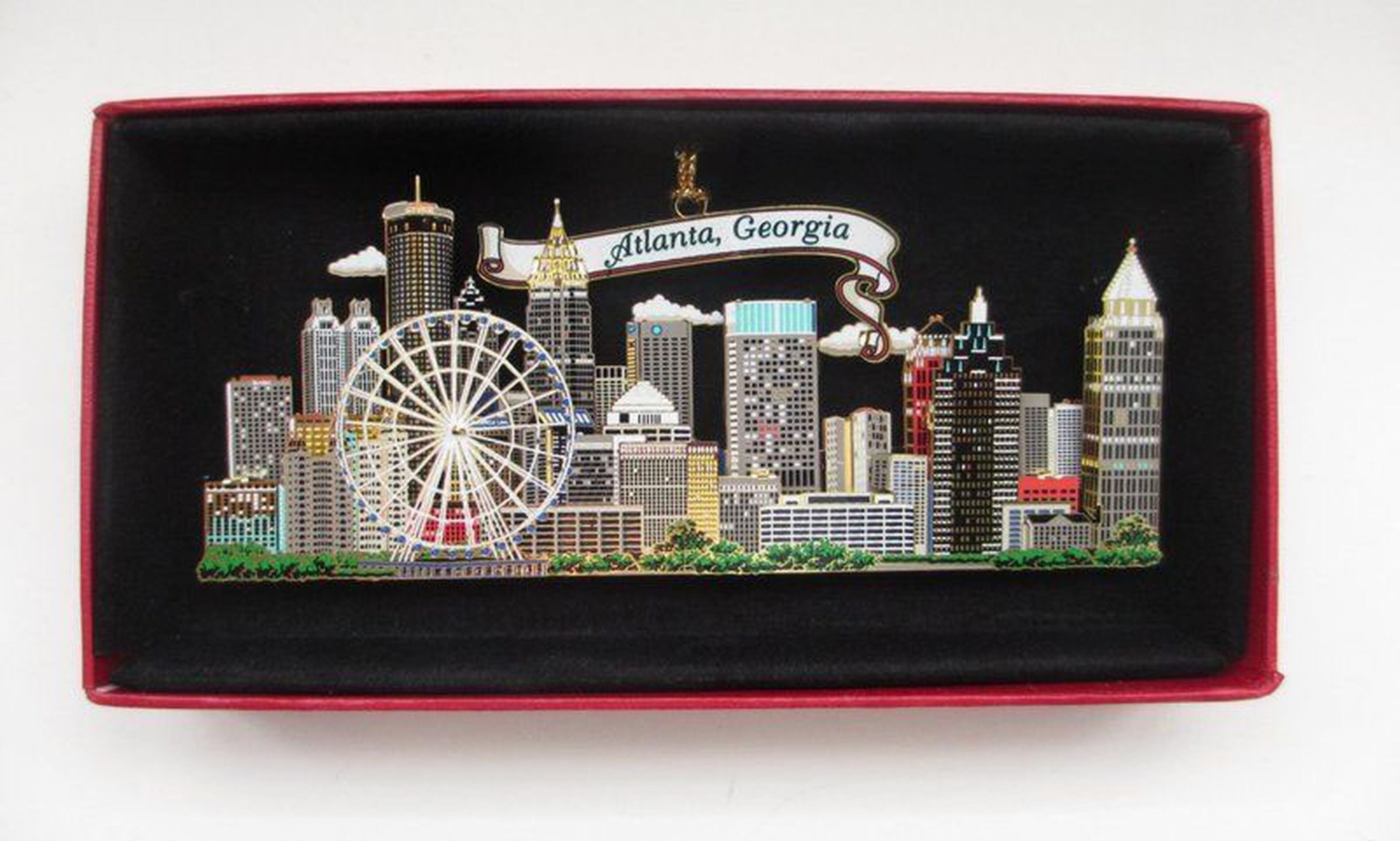 This image is from an eBay sale of a brass ornament of the Atlanta skyline, which features the SkyView Ferris wheel prominently.