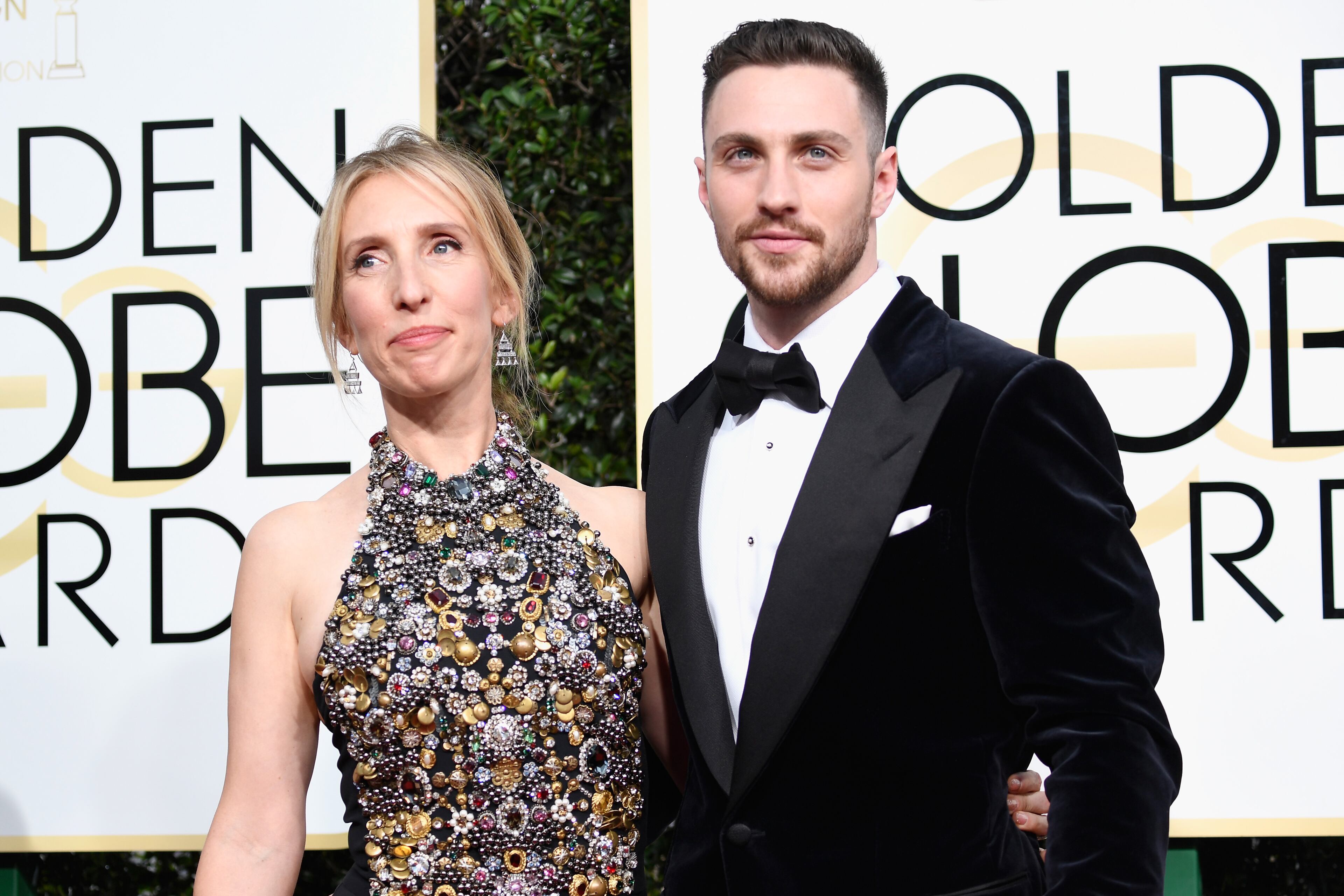 BEVERLY HILLS, CA - JANUARY 08: Director Sam Taylor-Johnson (L) and actor Aaron Taylor-Johnson attends the 74th Annual Golden Globe Awards at The Beverly Hilton Hotel on January 8, 2017 in Beverly Hills, California. (Photo by Frazer Harrison/Getty Images)