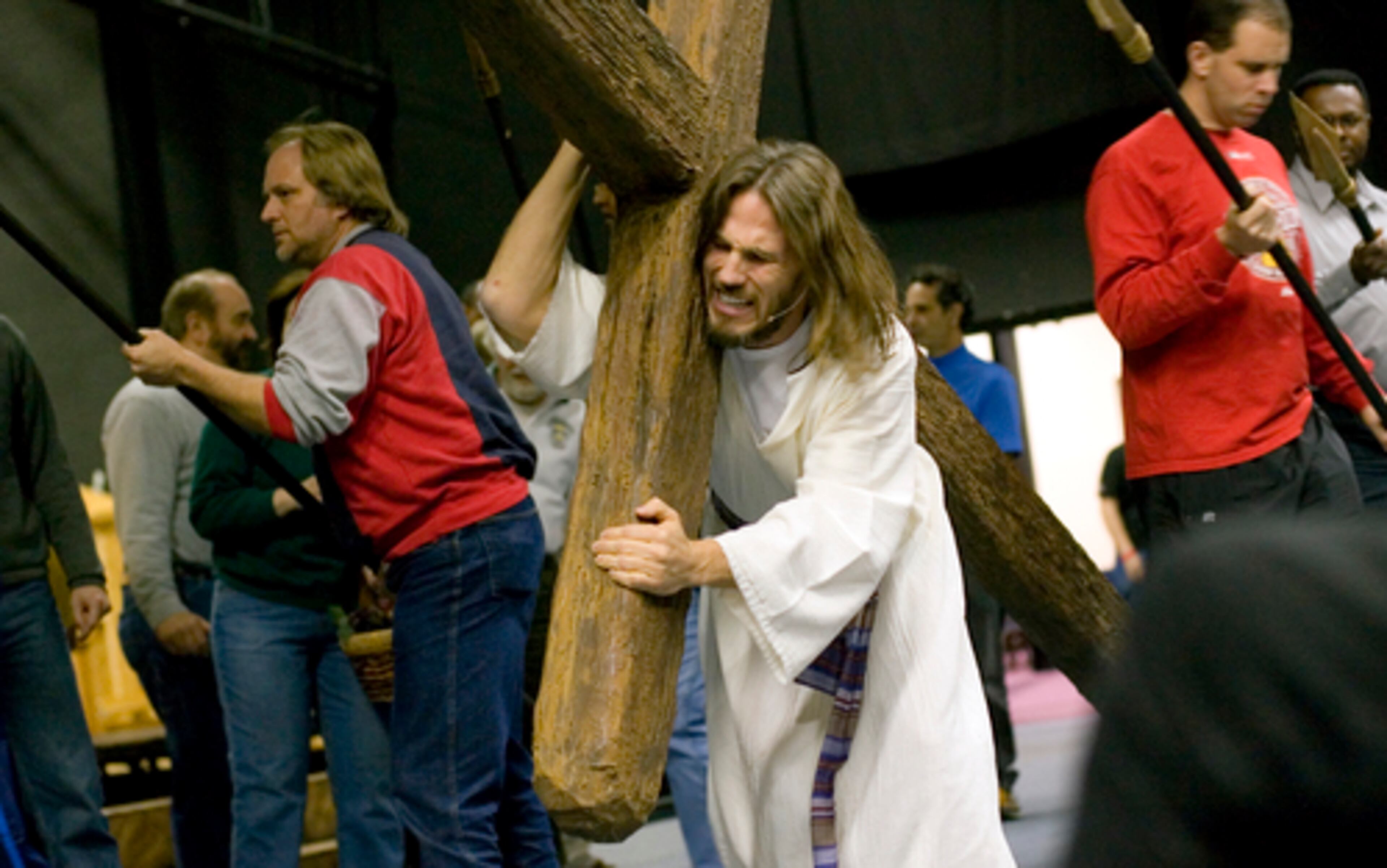 Britt, playing Jesus, carries the cross.
