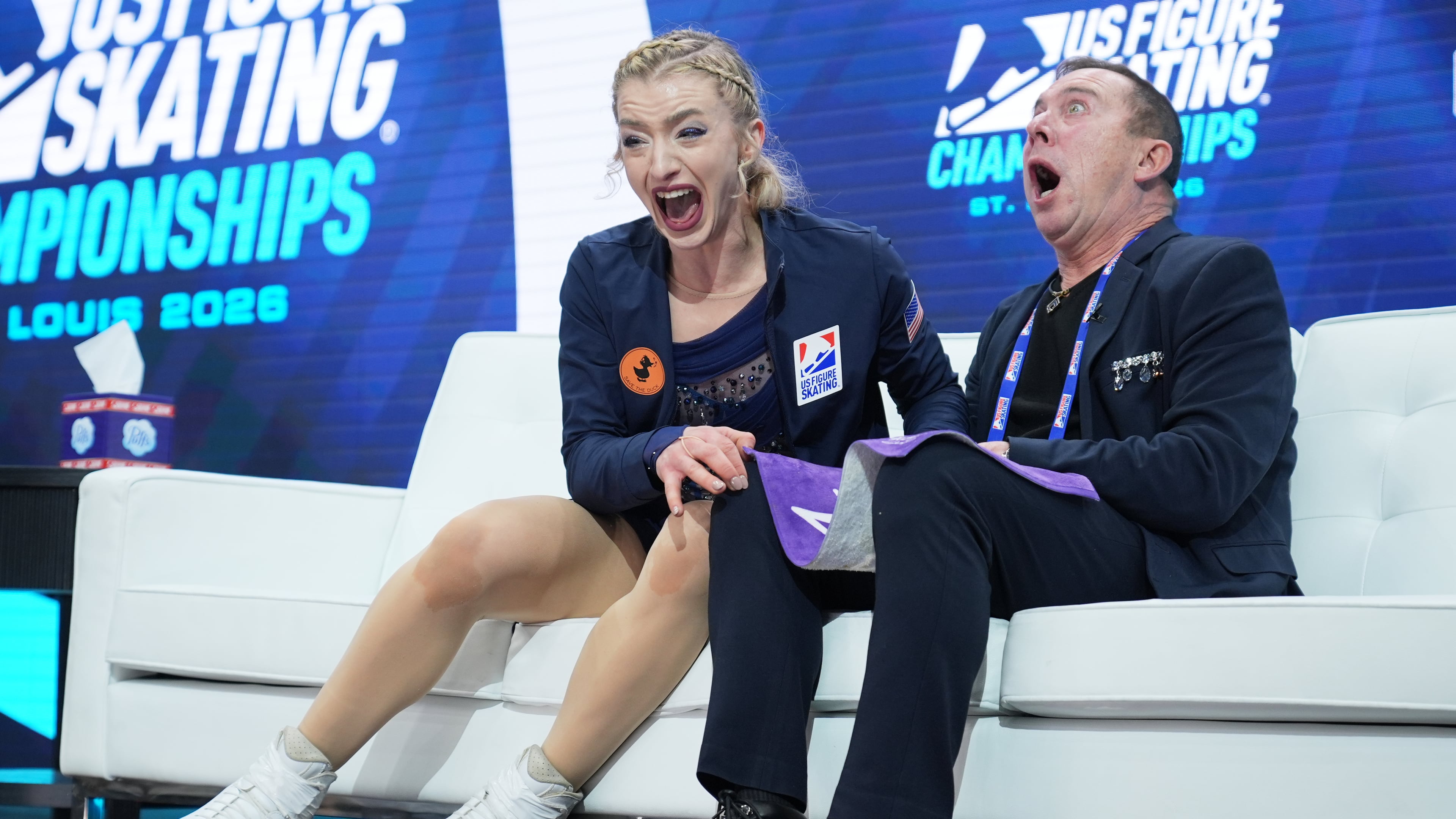 Amber Glenn reacts to seeing her scores after competing during the women's free skating competition at the U.S. Figure Skating Championships, Friday, Jan. 9, 2026, in St. Louis. (AP Photo/Stephanie Scarbrough)