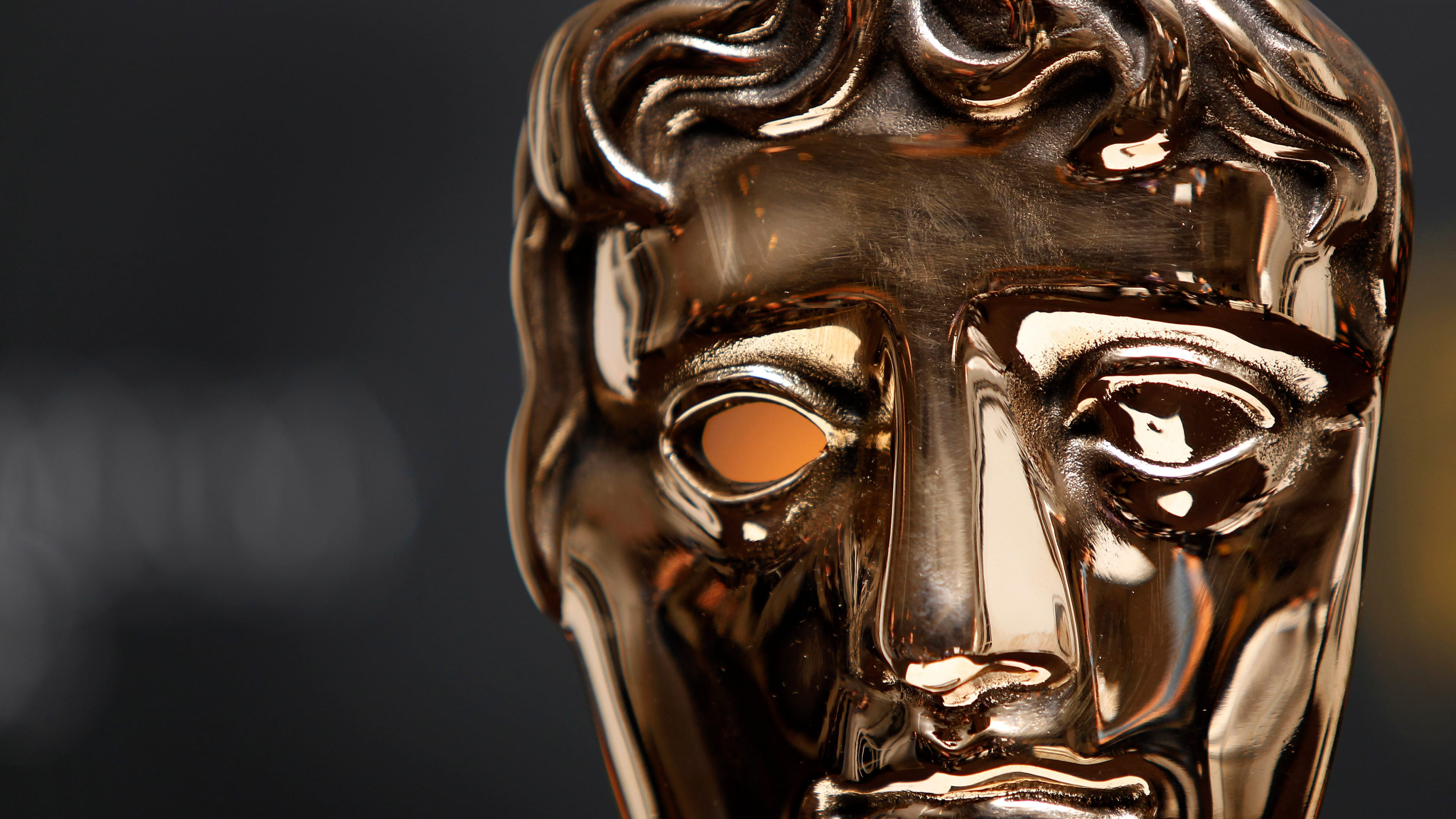 FILE - A BAFTA mask after the nominations for the Orange British Academy Film Awards 2011 were announced, Tuesday, Jan. 18, 2011, in Piccadilly, London. (AP Photo/Joel Ryan, File)