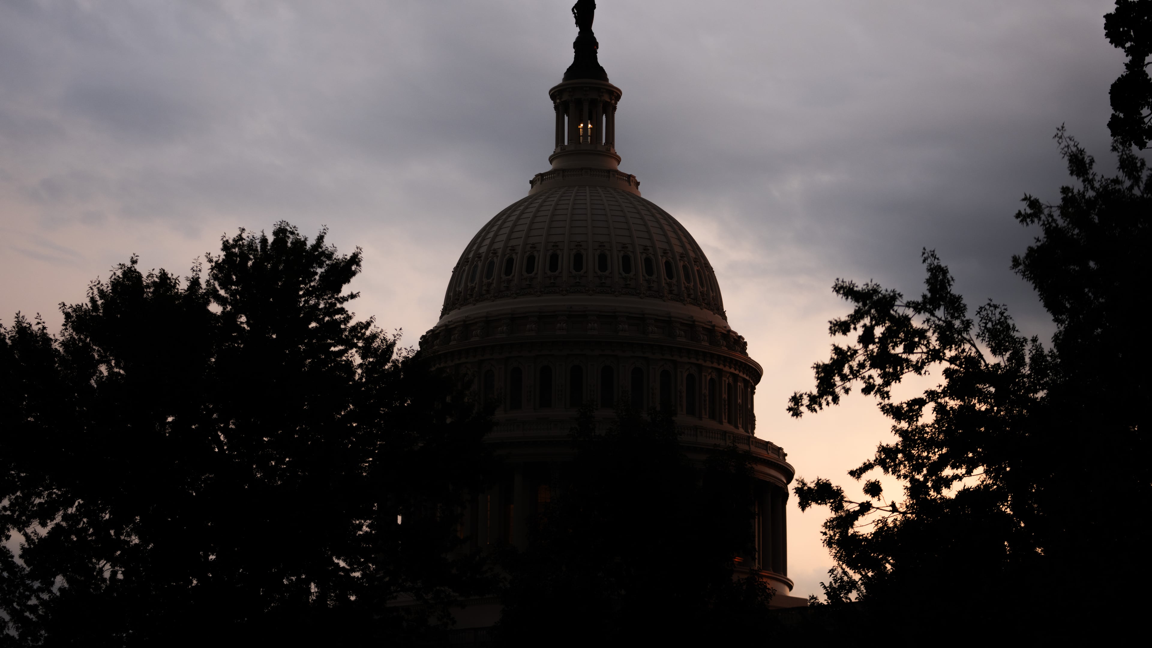 The sun sets behind the U.S. Capitol, Tuesday, July 28, 2026, in Washington. (AP Photo/Allison Robbert)