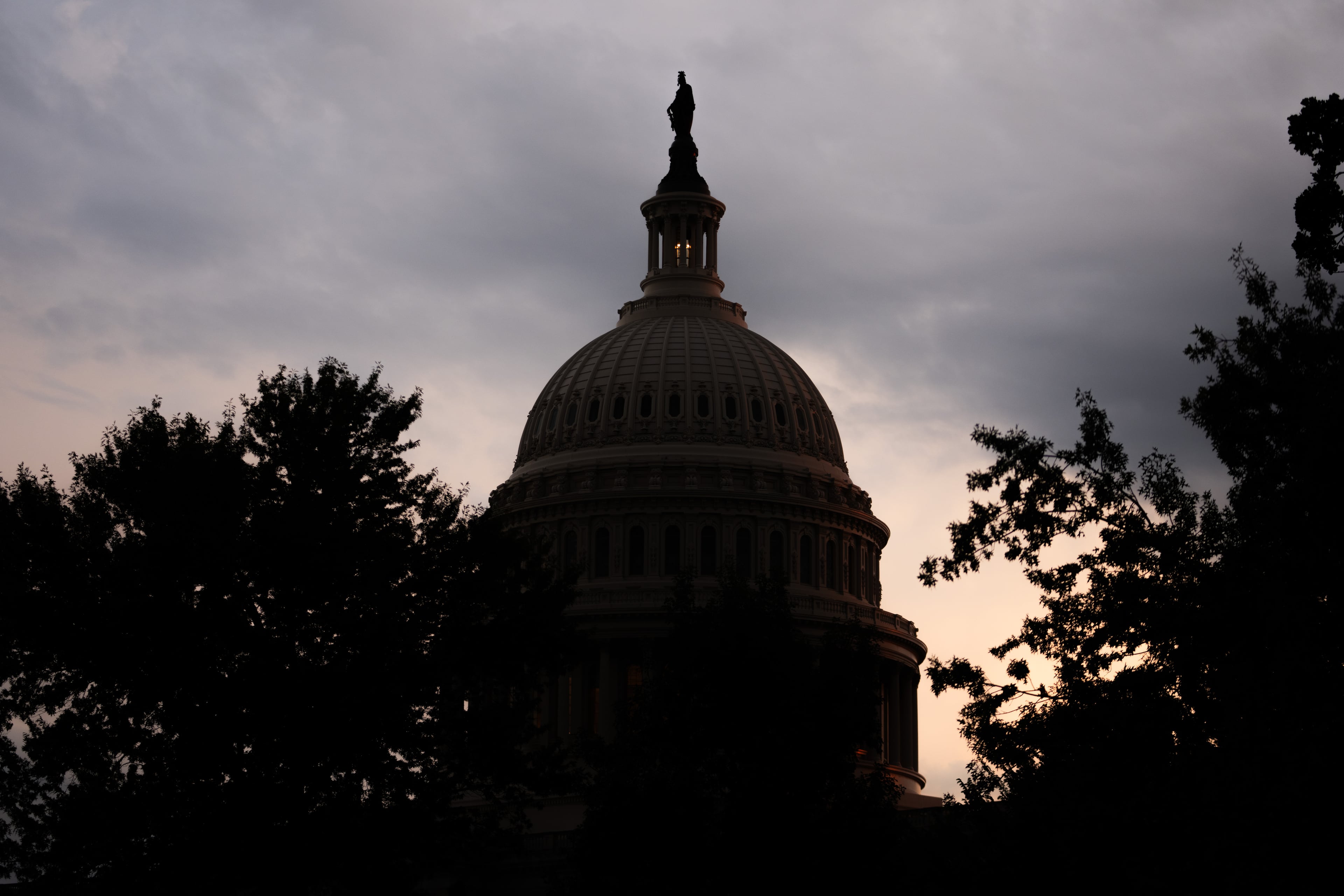 The sun sets behind the U.S. Capitol last month in Washington, D.C. (Allison Robbert/AP)