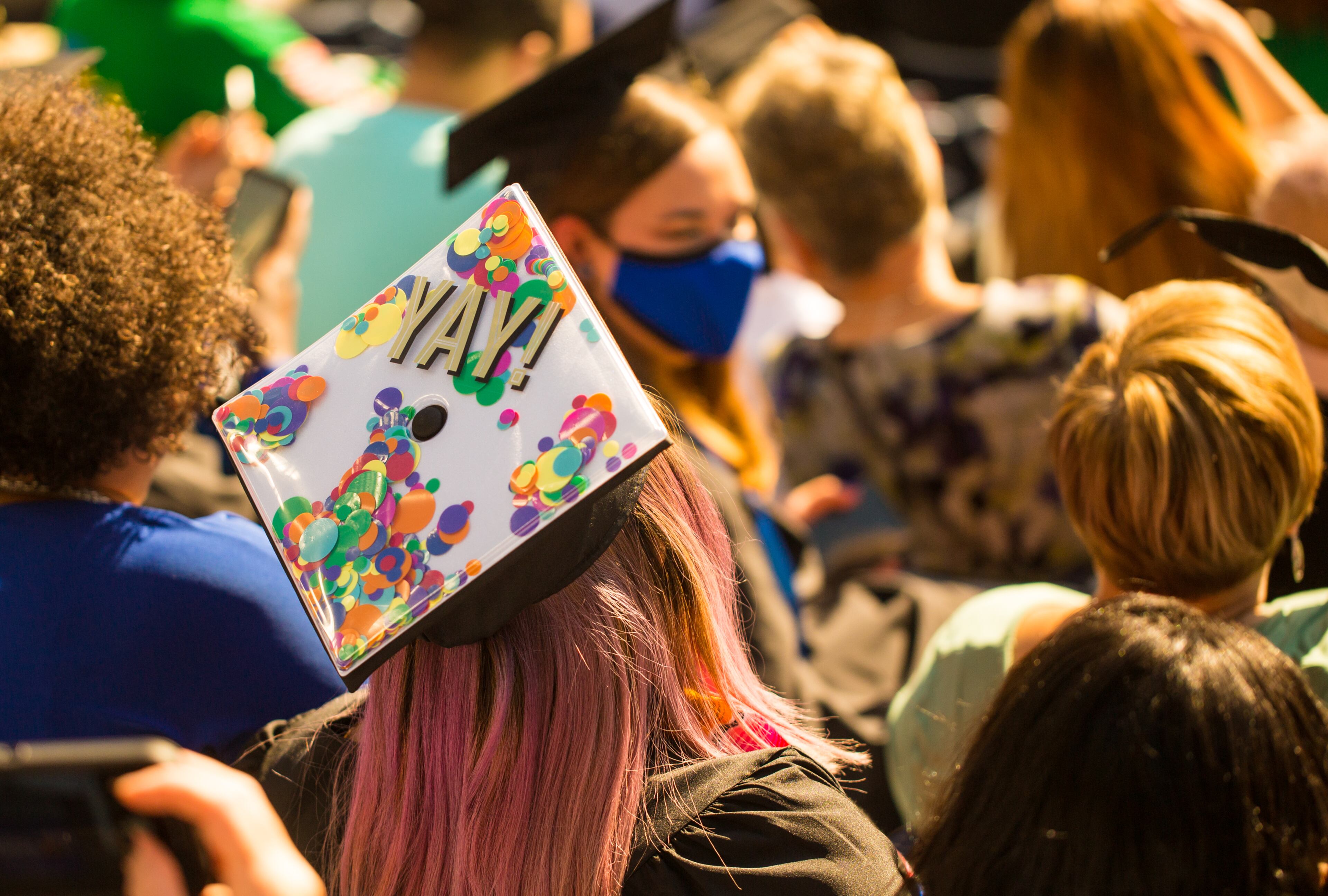 Georgia State University graduation at Center Parc Stadium on Thursday, May 6, 2021 has adjusted for the pandemic with graduates placed in pods where they celebrate with friends and family as their names are read, rather than walking the stage. GSU graduated 5000 students this year. (Jenni Girtman for The Atlanta Journal - Constitution)