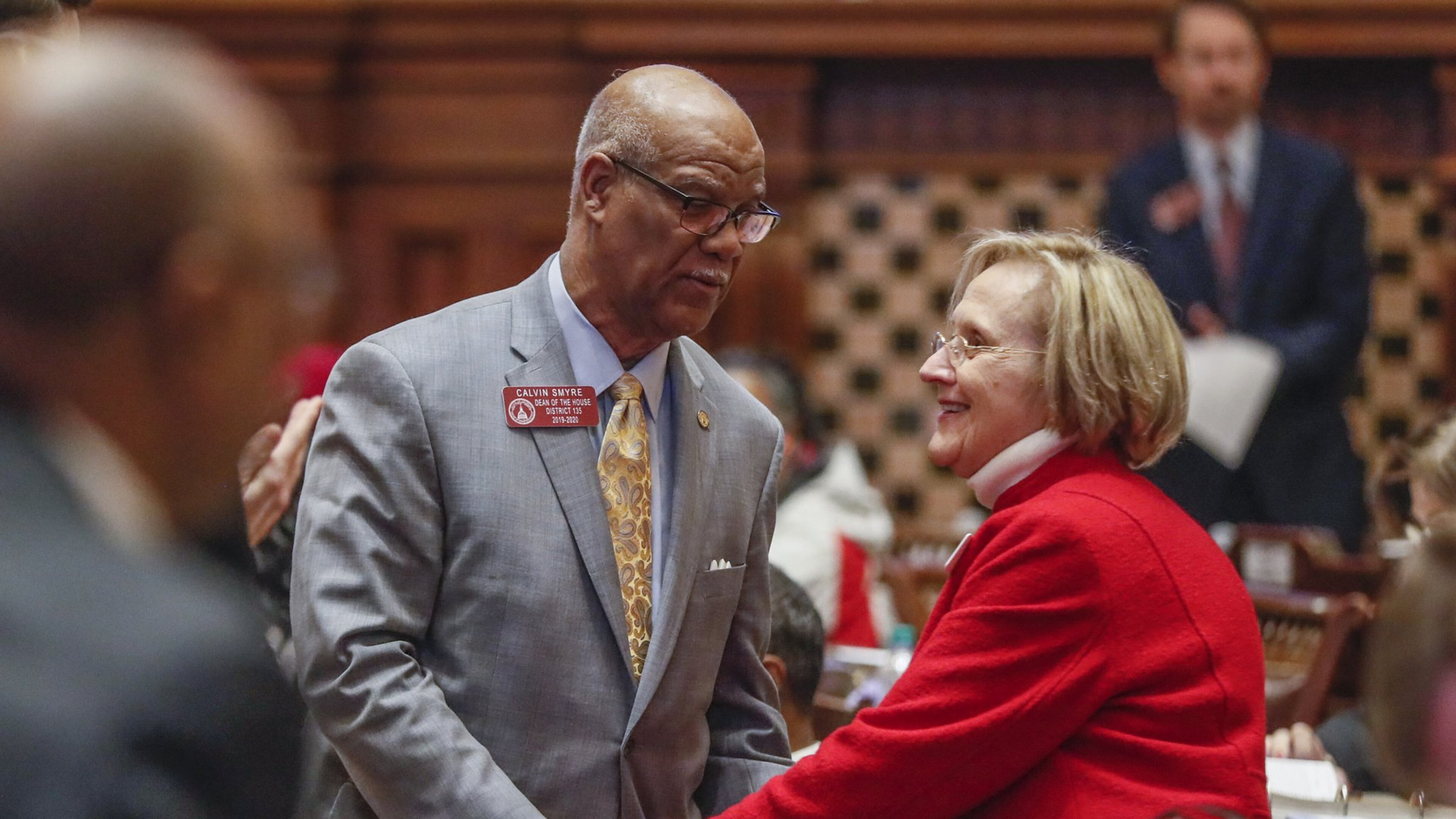 State Rep. Sharon Cooper (right), R-Marietta, is congratulated by Rep. Calvin Smyre, D-Columbus, after the passage of her bill on Feb. 28, 2020. Smyre spoke in support of the bill. The Georgia house passed HB 987, sponsored by Cooper, to provide additional measures for the protection of elderly persons and better regulate assisted living facilities. Bob Andres / robert.andres@ajc.com