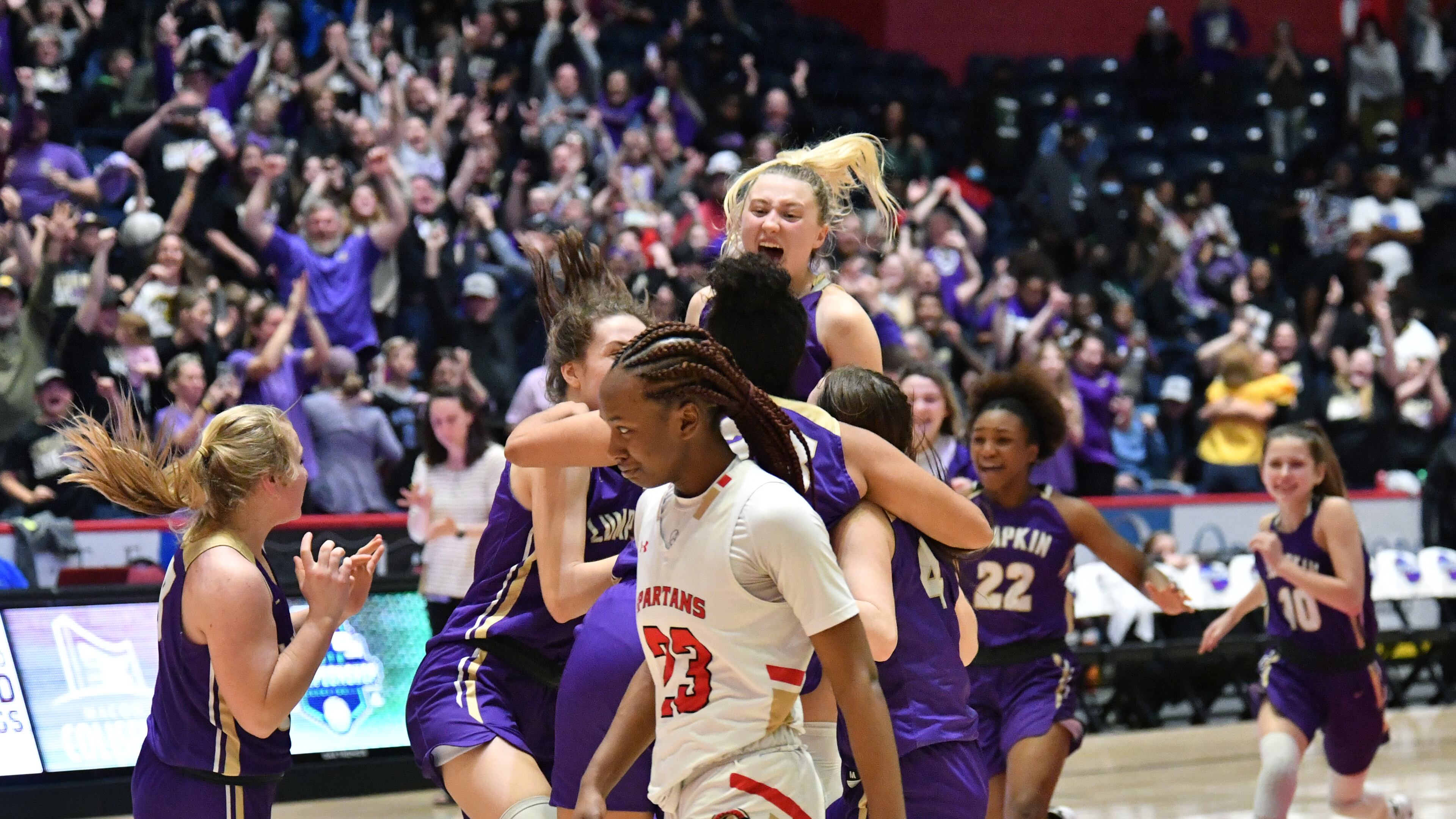 March 11, 2022 Macon - Greater Atlanta Christian's Trinity Thomas (23) reacts as Lumpkin County players celebrate their victory over Greater Atlanta Christian during the 2022 GHSA State Basketball Class AAA Girls Championship game at the Macon Centreplex in Macon on Friday, March 11, 2022. (Hyosub Shin / Hyosub.Shin@ajc.com)
