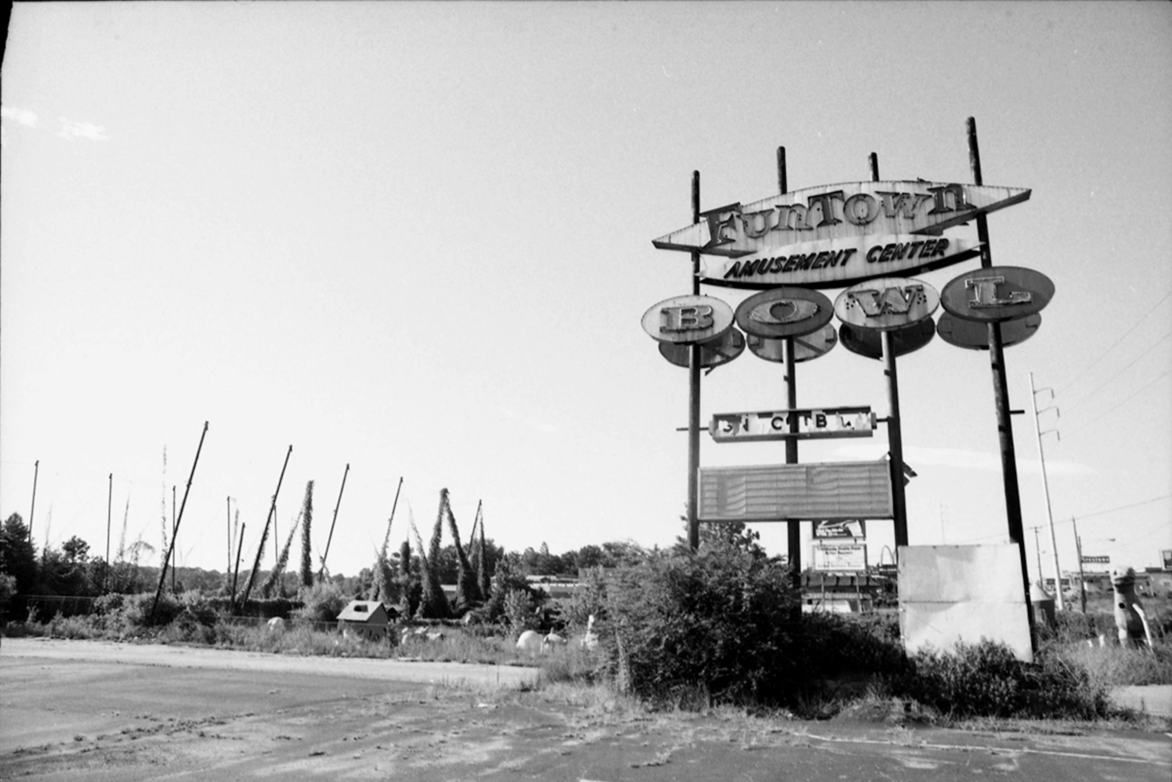 The following images of the Funtown ruins were taken for an AJC article in 1981. This picture shows the entrance to the mini golf area. In the back left, poles still hold up the netting for the batting cages. (W.A. Bridges AJC Collection at the GSU Library, AJCNS1981-07-21h)