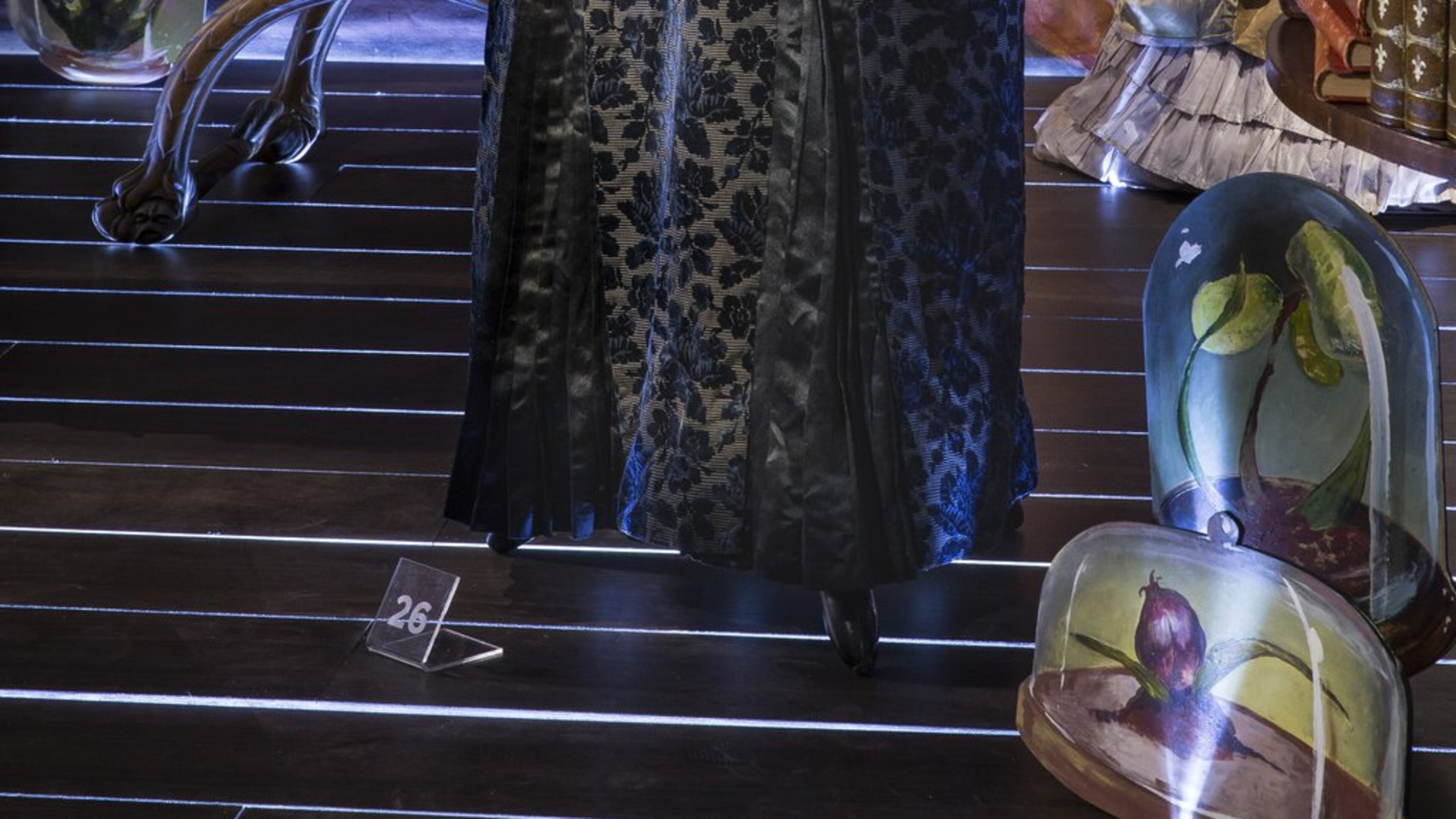 An 1880 walking dress in midnight blue silk velvet with a bustle skirt and woven velvet ornamentation is featured in “Threads of History: Two Hundred Years of Fashion.” (Contributed)