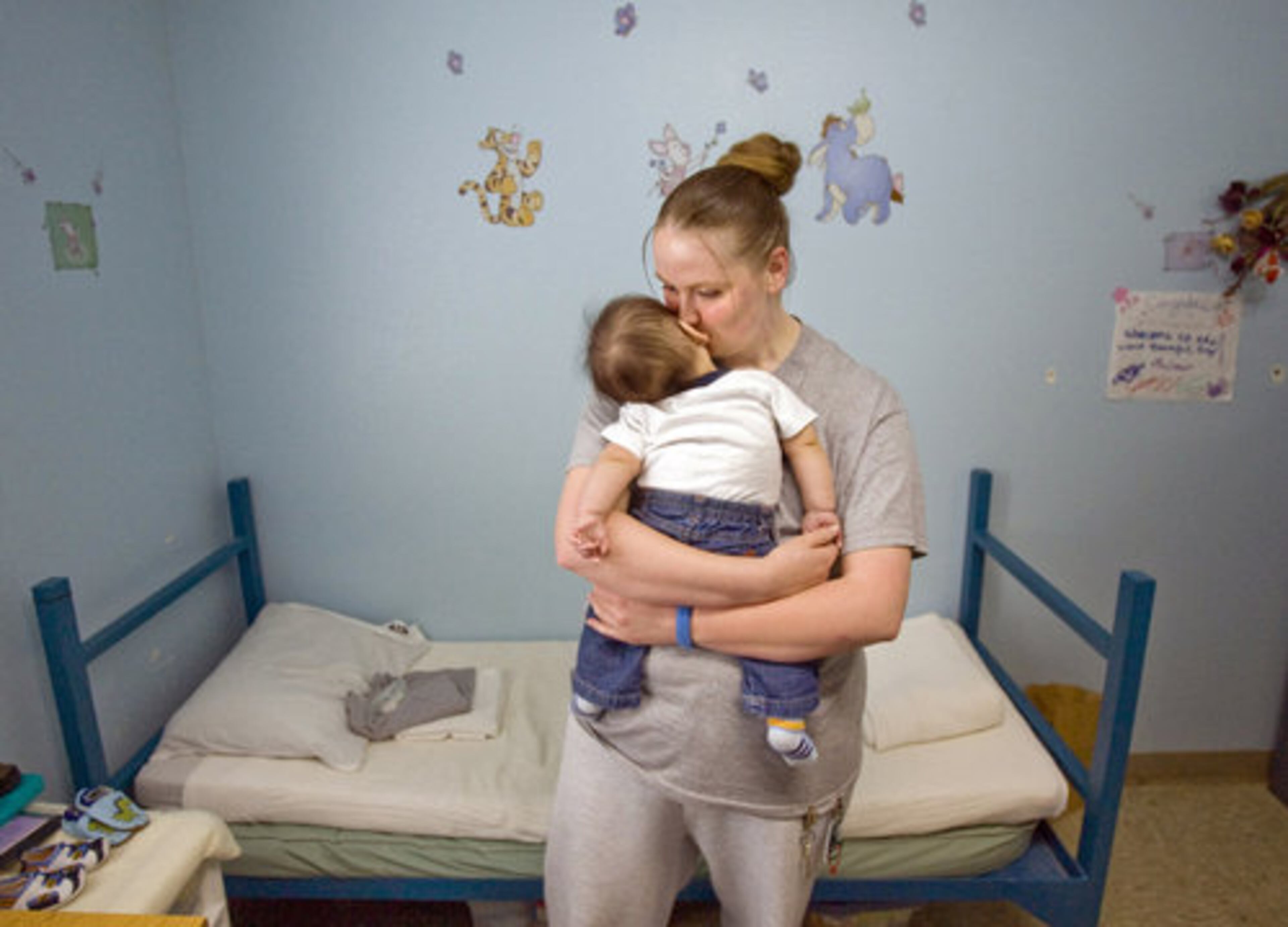Amanda Long, 21, of Rochester, Wash., cuddles with 4 1/2-month-old Dionicio in her room at the Washington Corrections Center for Women, where she is part of the Residential Parenting Program.