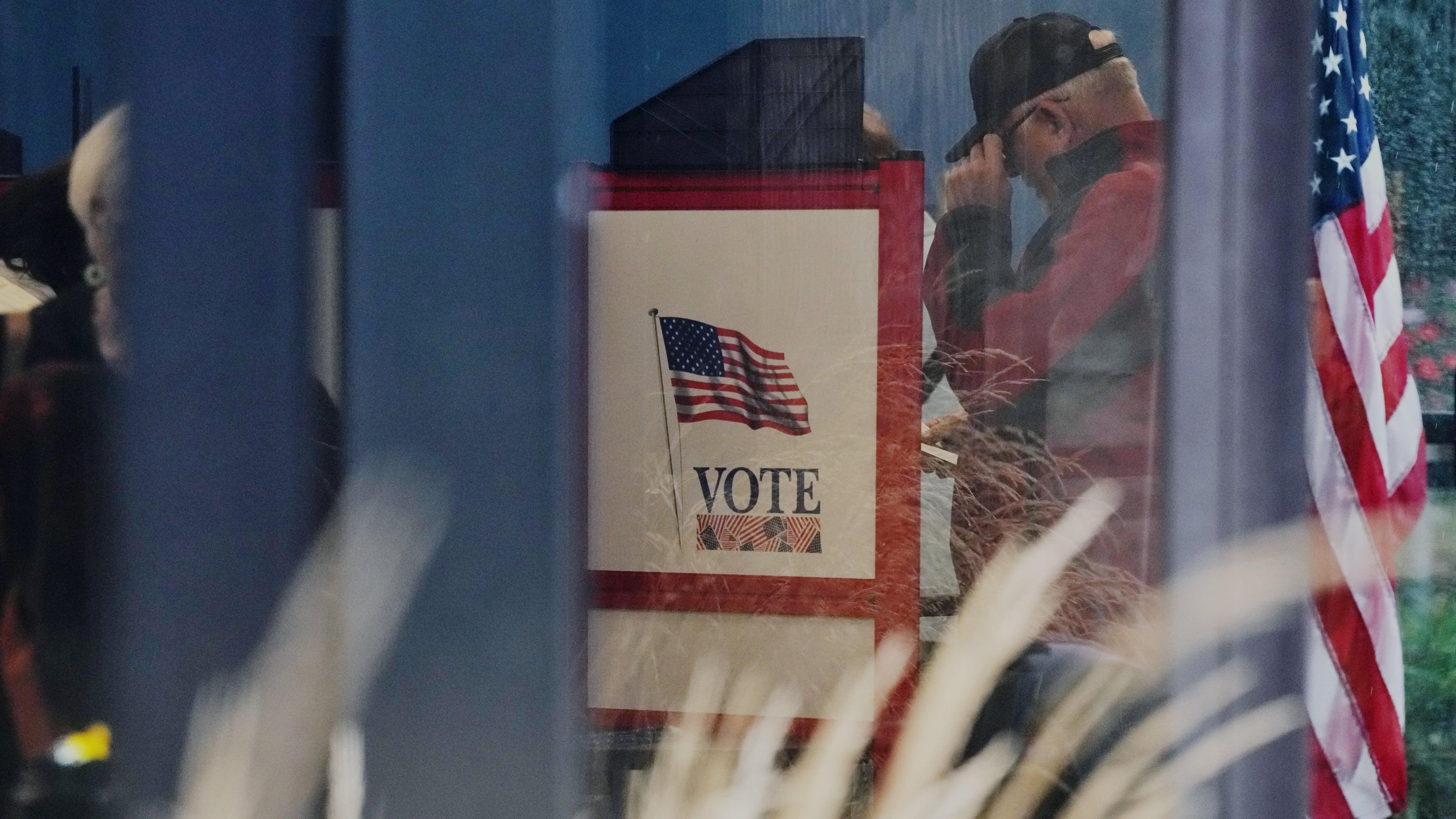 A voter casts a ballot on the first day of early voting in Minnesota at the Elections & Voter Services building, Friday, Sept. 18, 2026, in Minneapolis. (AP Photo/Ellen Schmidt)
