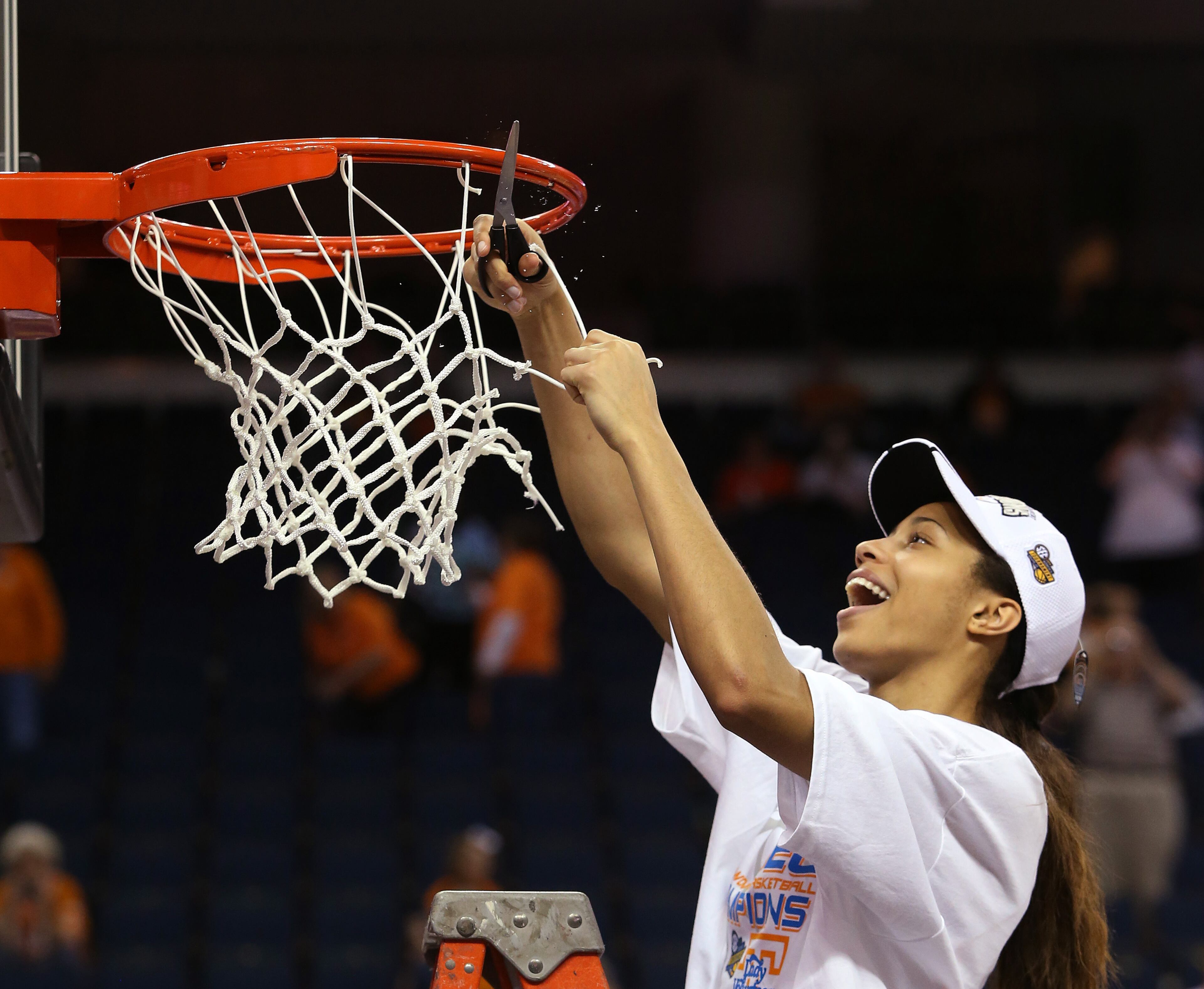Tennessee center Isabelle Harrison cuts down the net after defeating Kentucky 71-70 in an NCAA college basketball game in the finals of the Southeastern Conference women's basketball tournament Sunday, March 9, 2014, in Duluth, Ga. Harrison was named the tournament MVP. (AP Photo/Jason Getz)